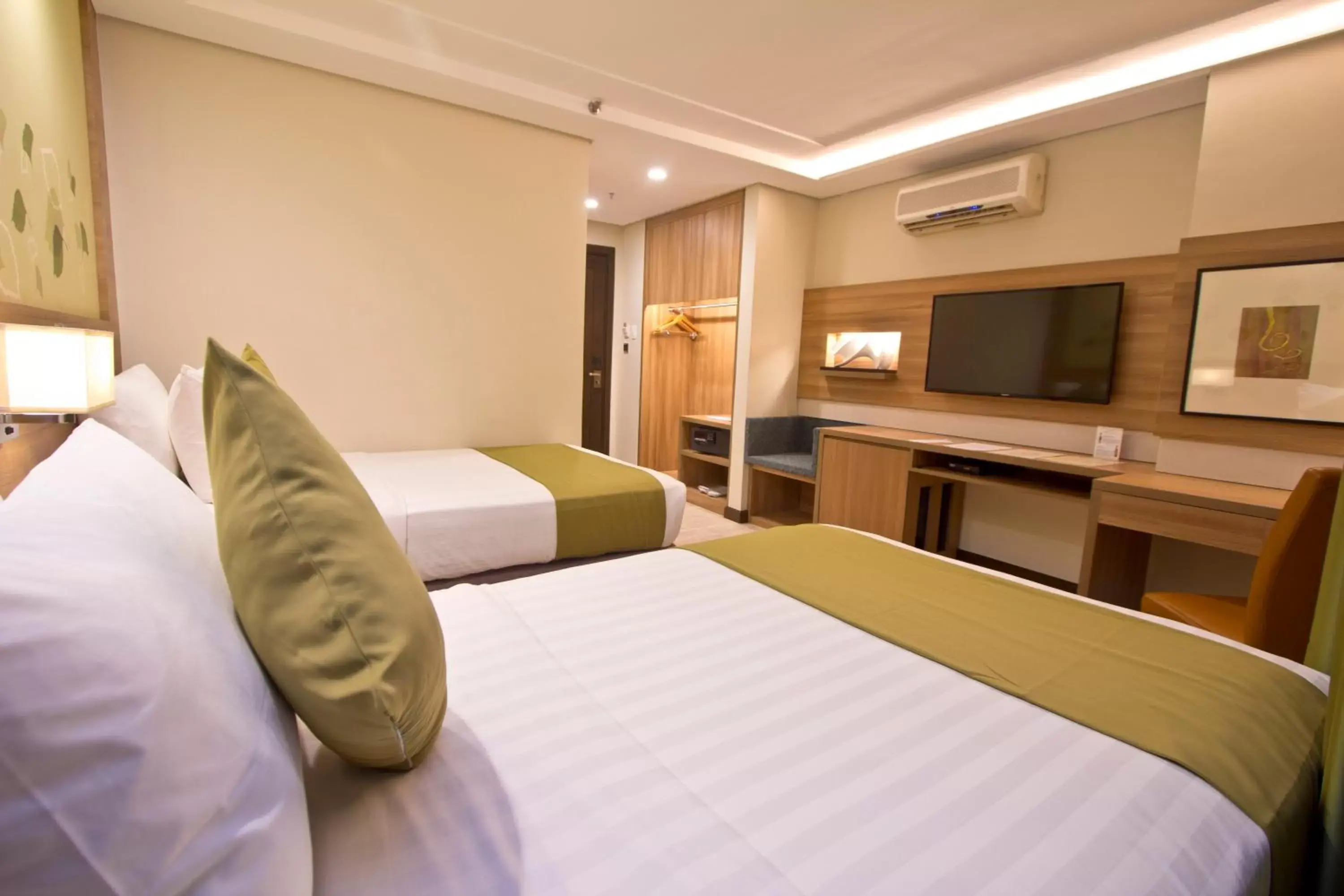 Bed in Crown Regency Hotel Makati