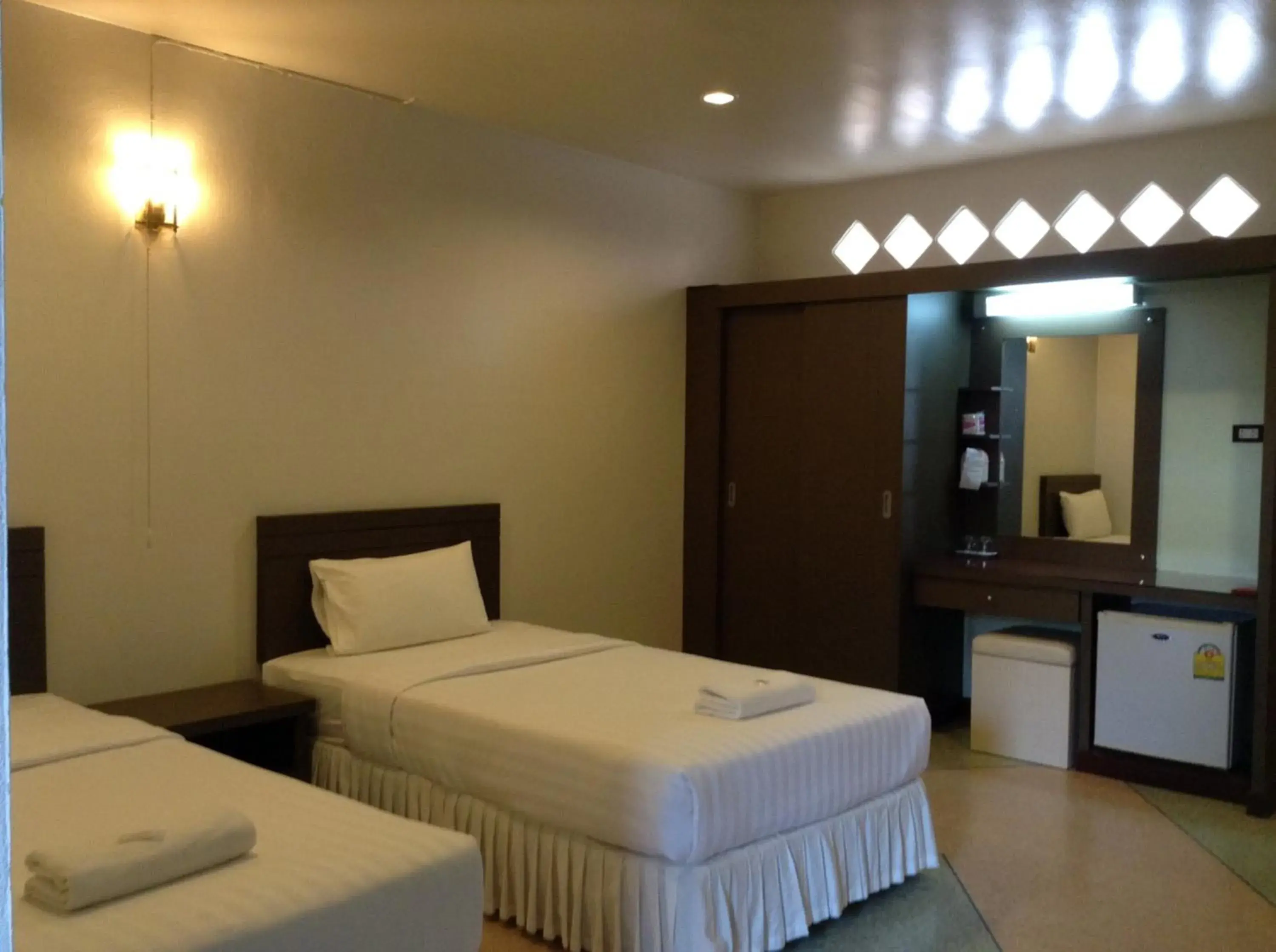 Photo of the whole room, Bed in Srisomthai Hotel