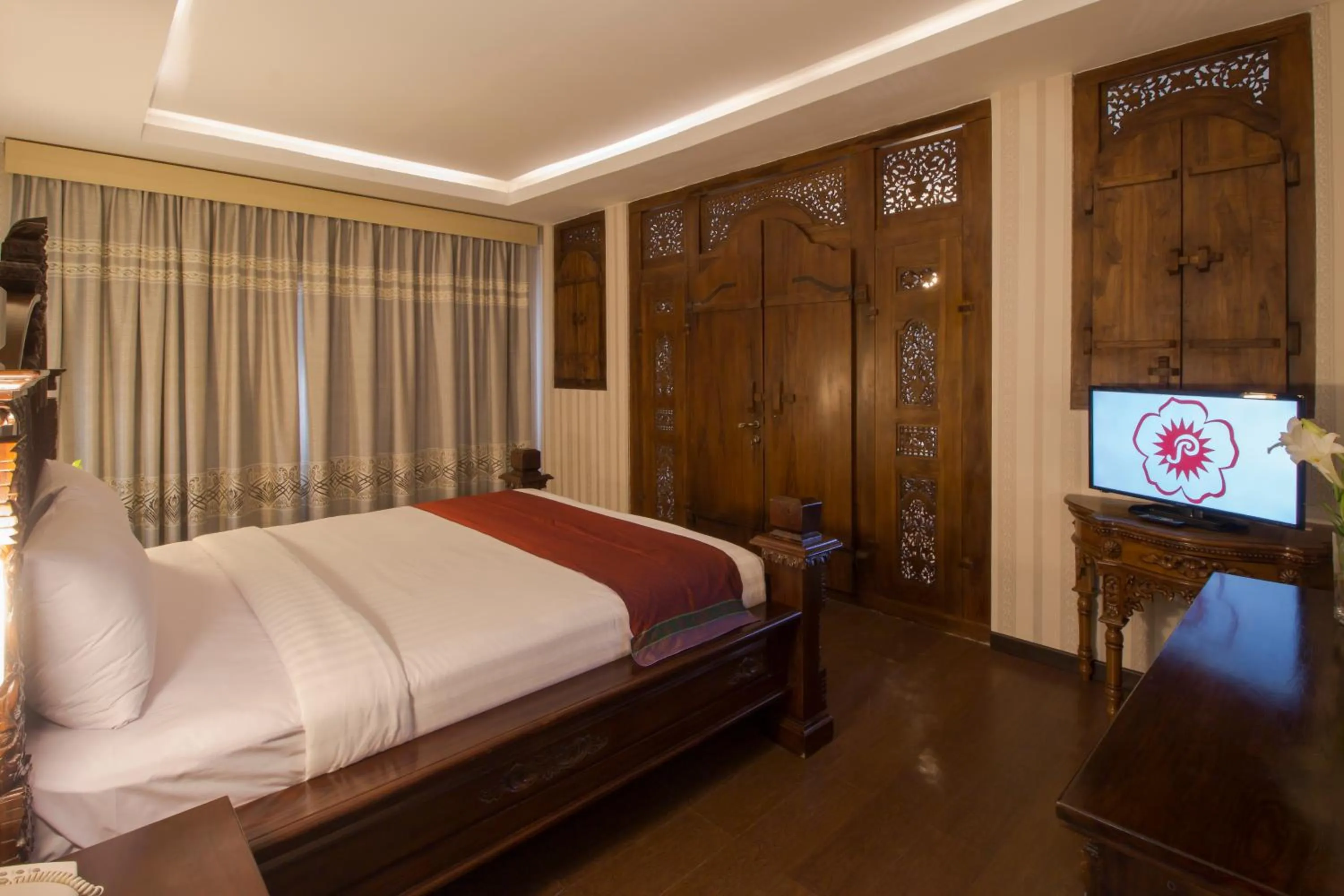 Bed in Grand Puri Saron Hotel Yogyakarta