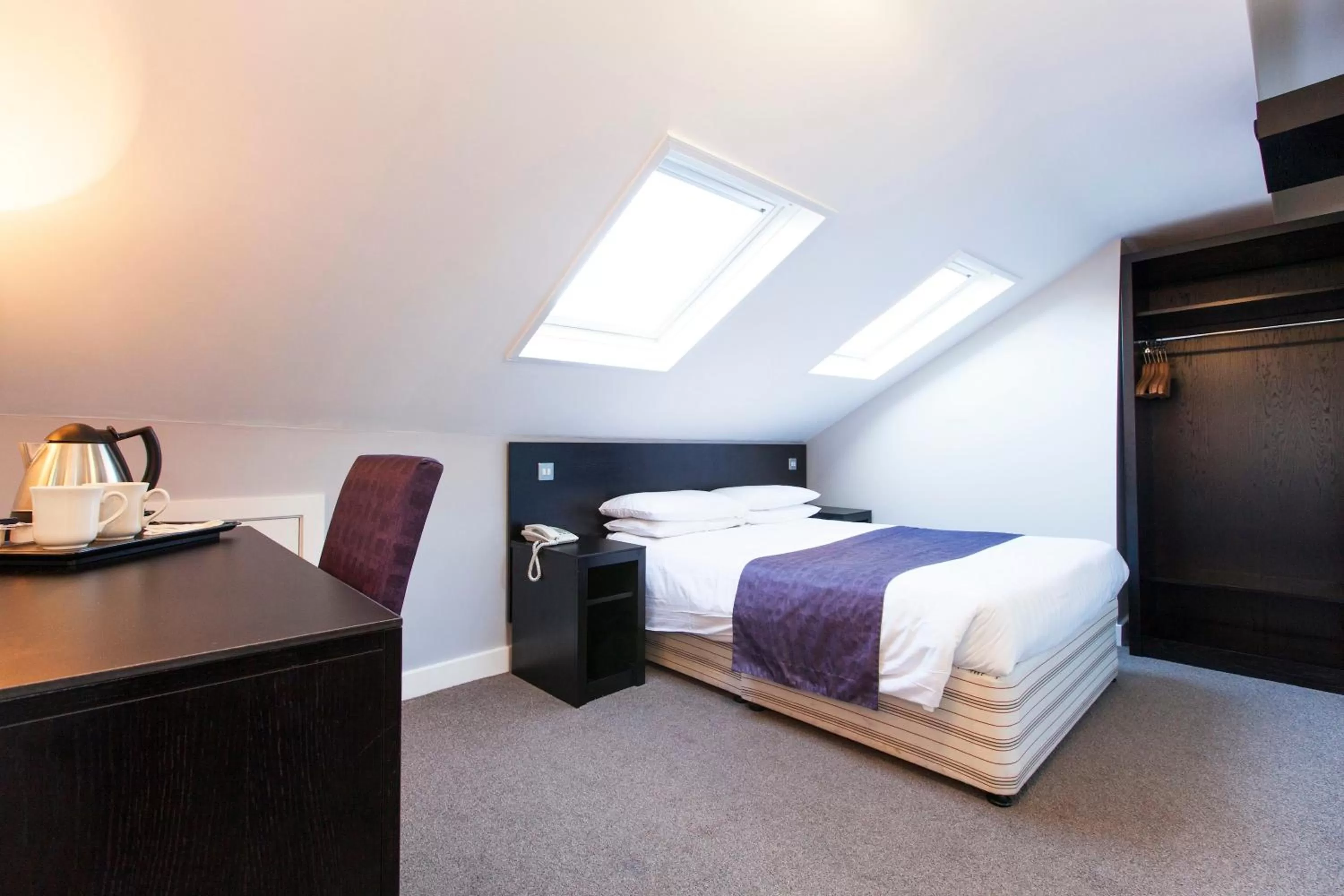 Bed in The Abbey Lodge Hotel