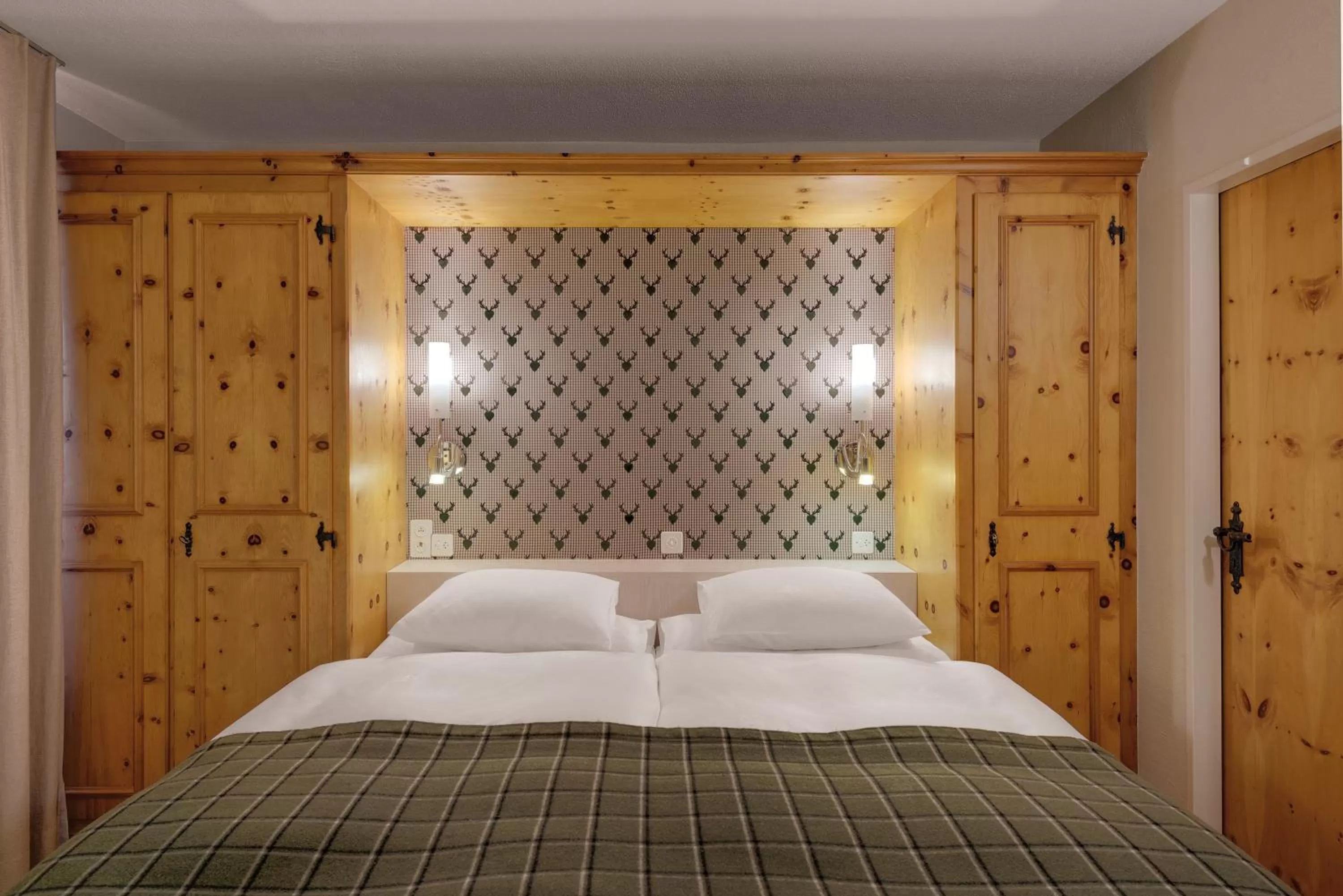 Decorative detail, Bed in Morosani Posthotel