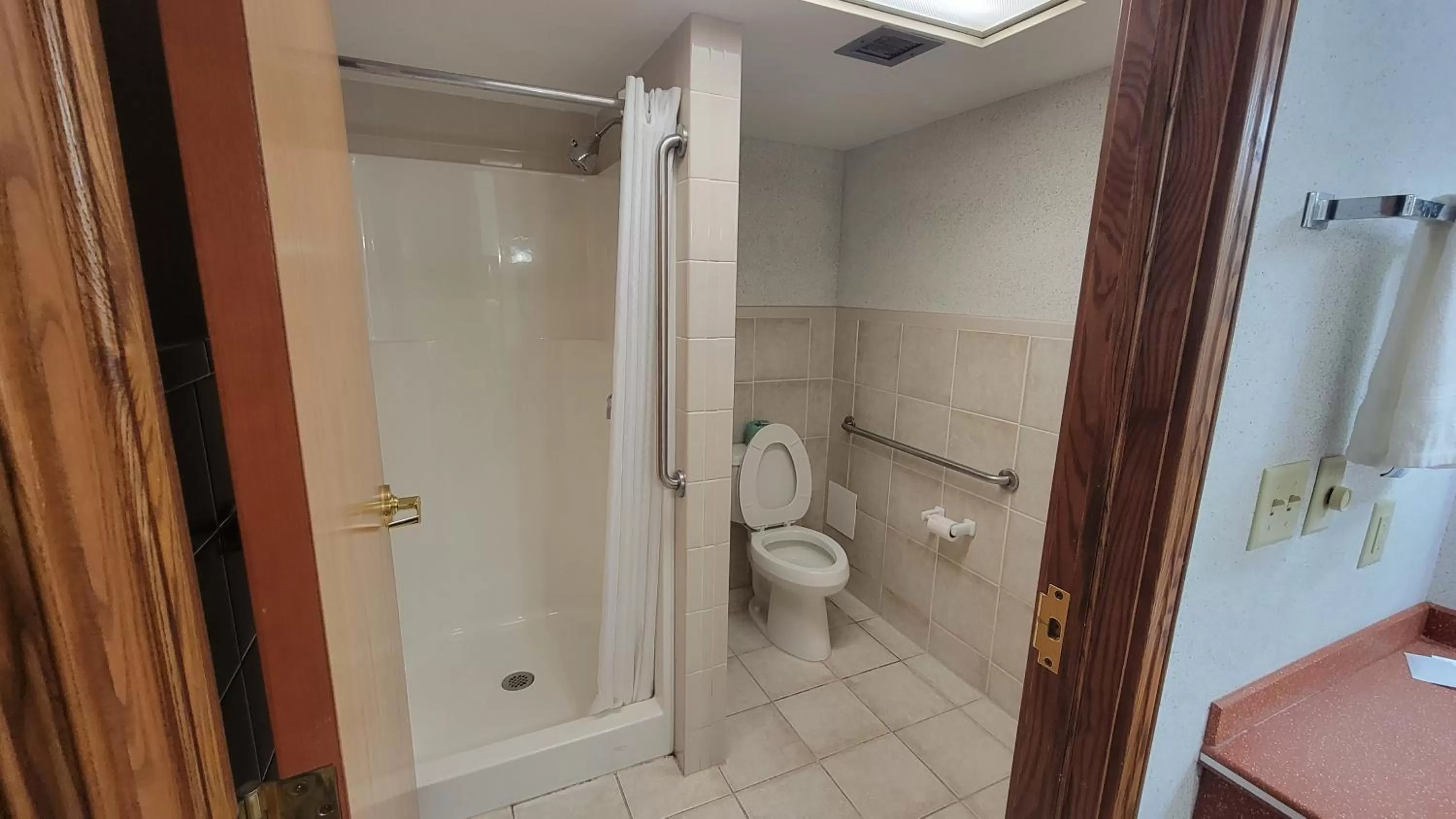 Bathroom in Ramada by Wyndham Saginaw Hotel & Suites