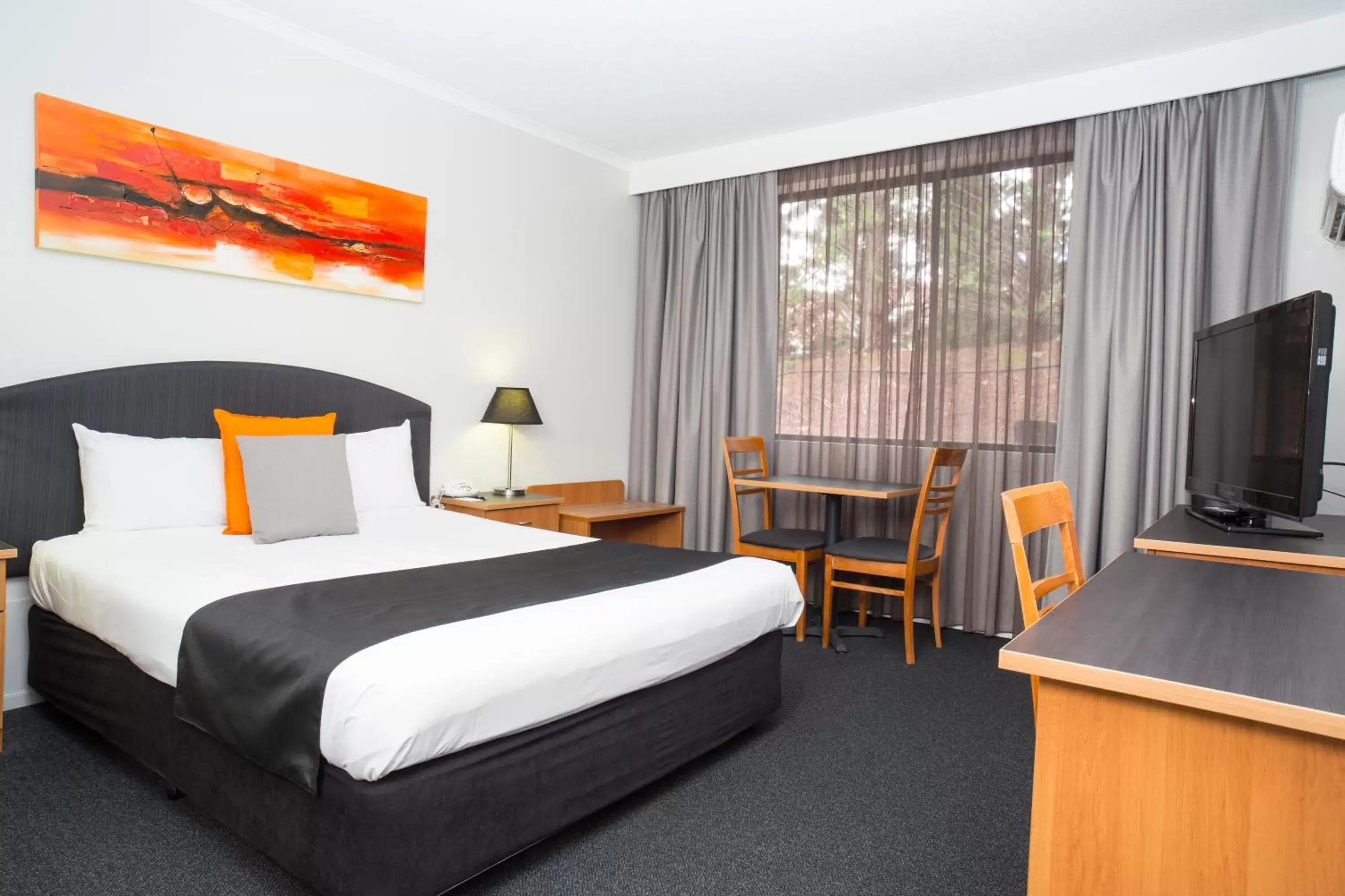 Bed in Alpha Hotel Canberra