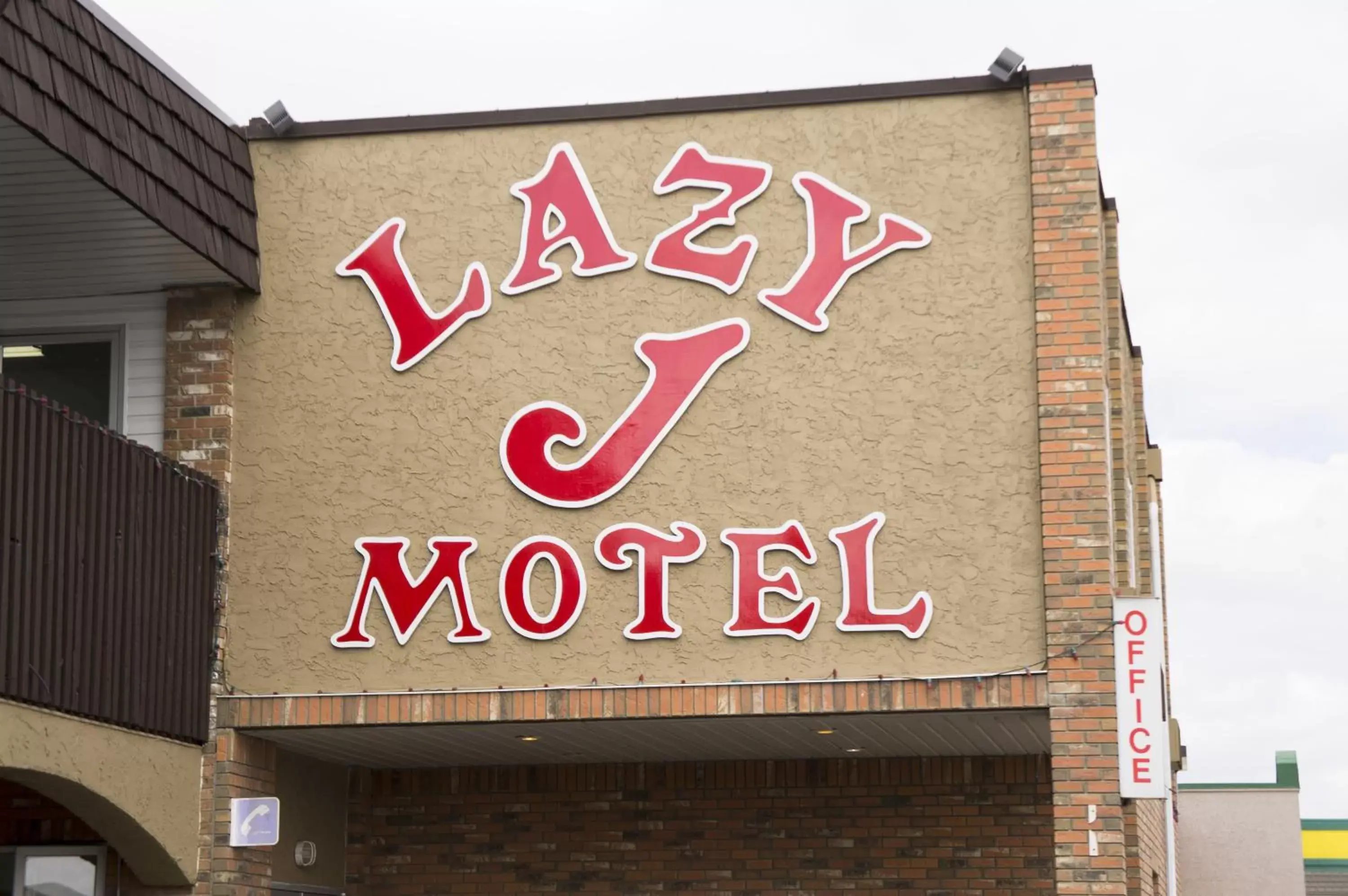 Property logo or sign in Lazy J Motel