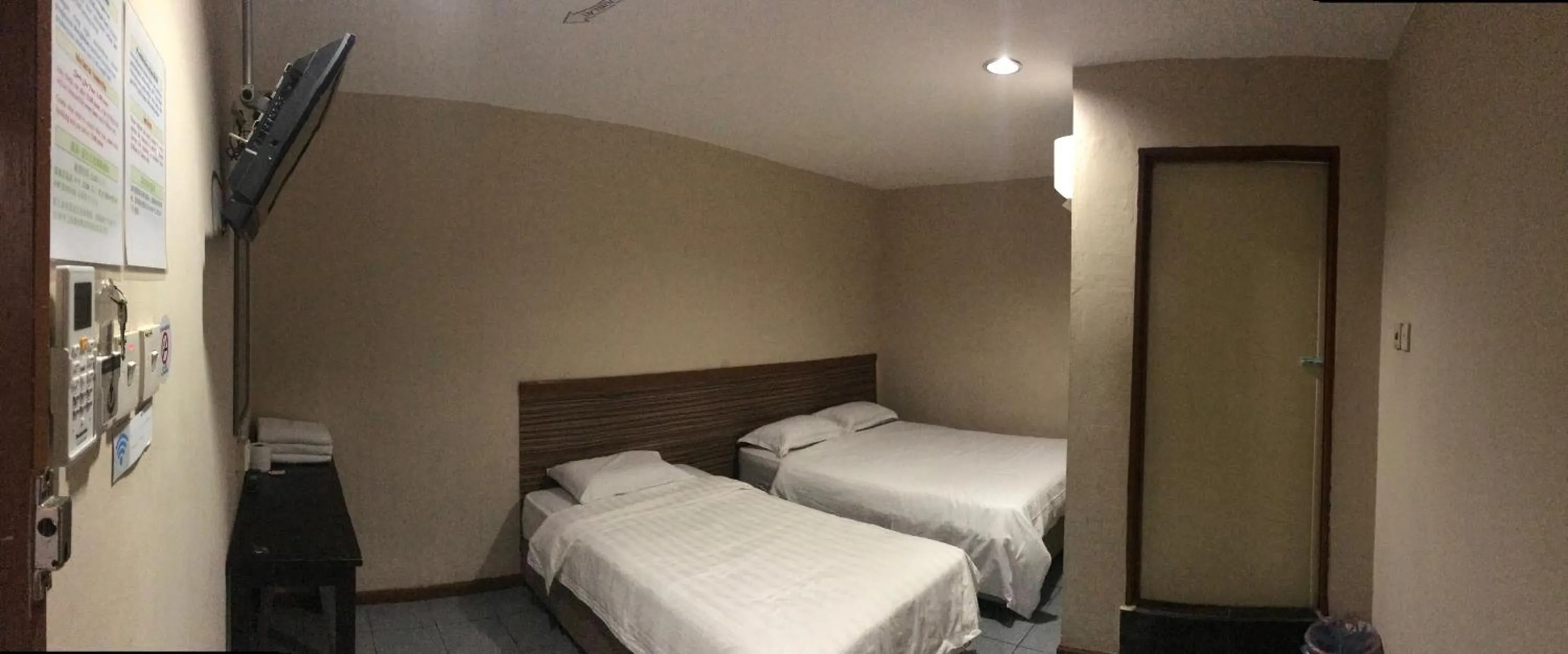 Photo of the whole room, Bed in Iskandar Sinsuran Guesthouse