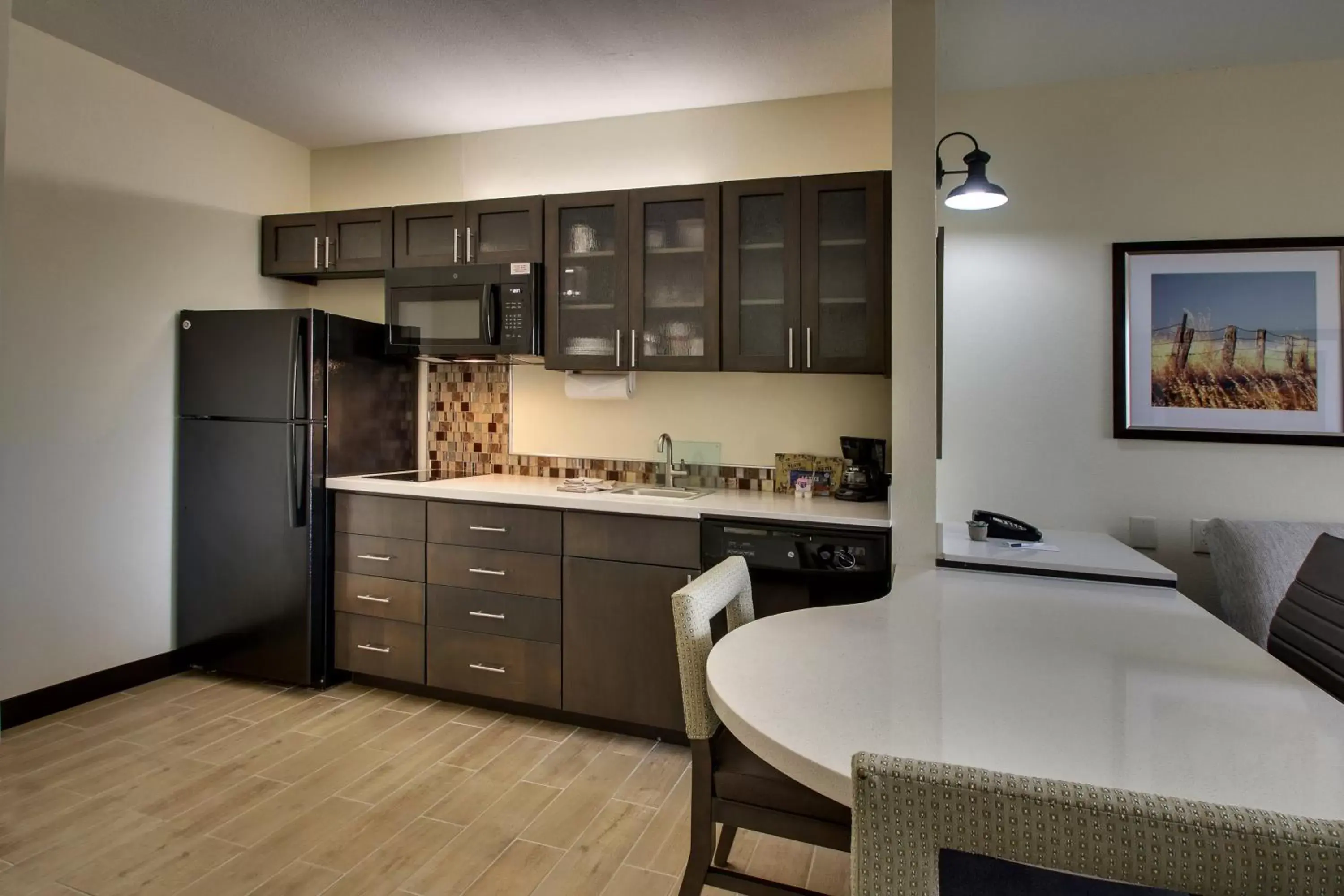 Photo of the whole room, Kitchen/Kitchenette in Candlewood Suites - Wichita East, an IHG Hotel