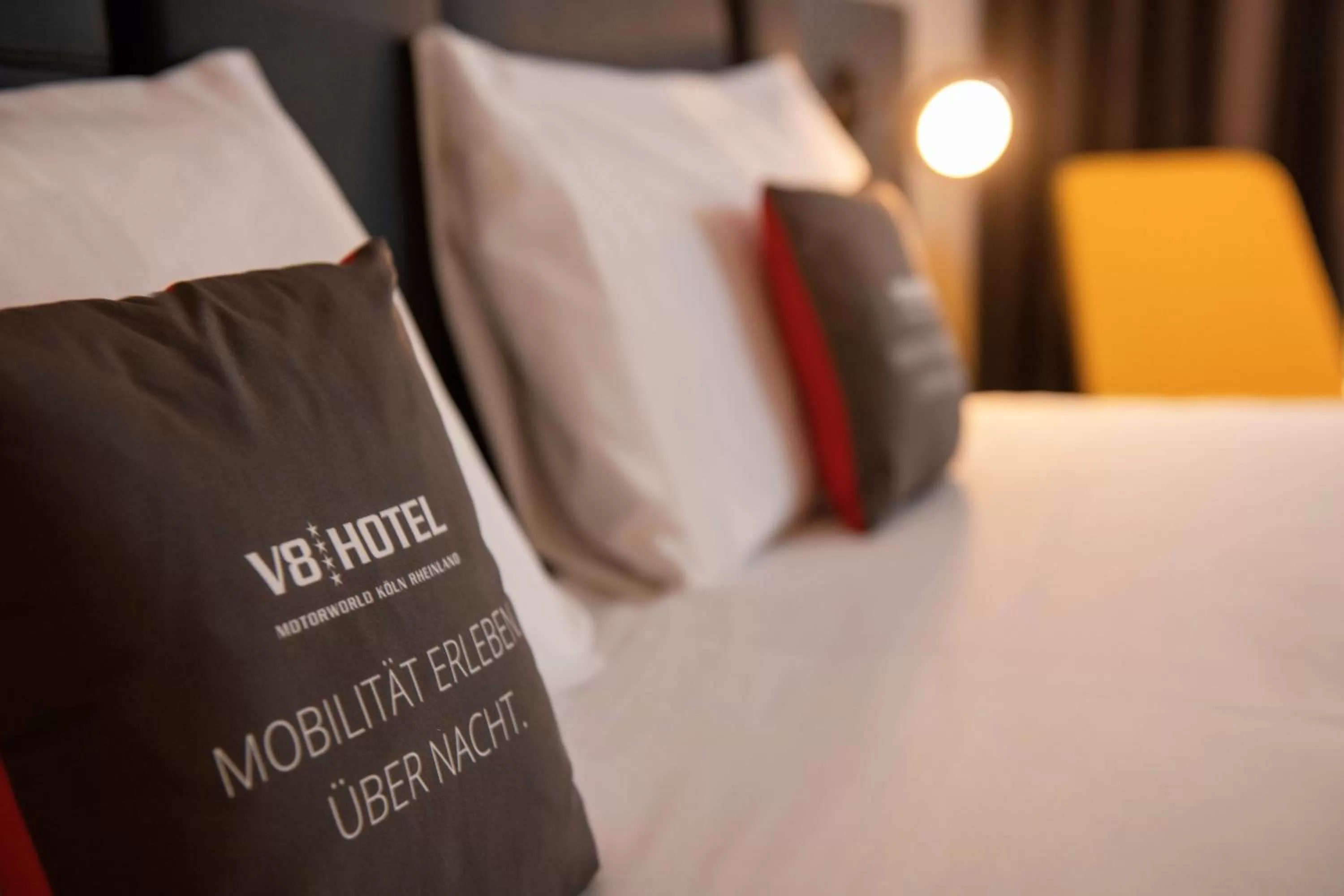 Bed in V8 Hotel Köln at MOTORWORLD