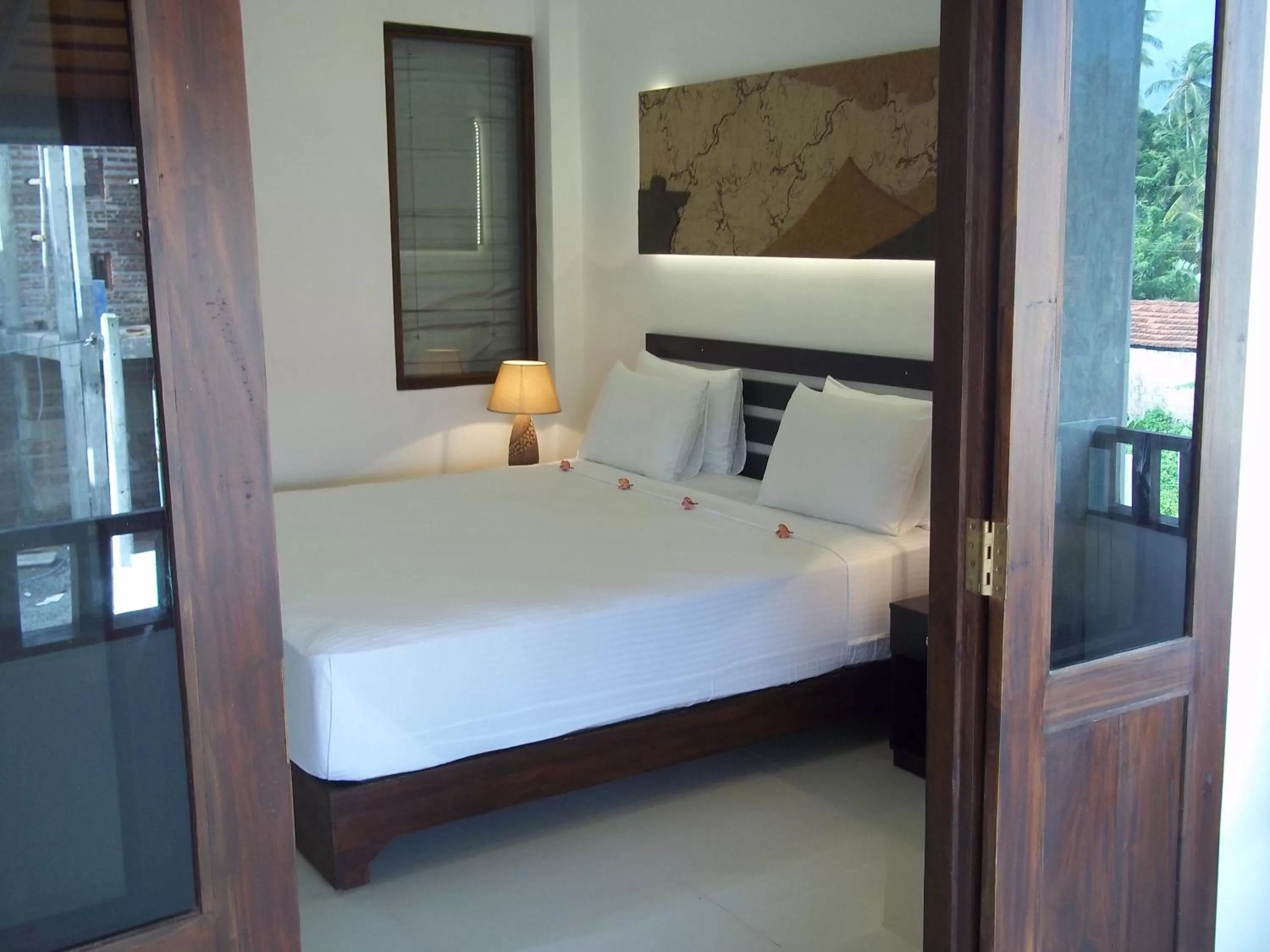 Bed in Sunrise Palace Negombo