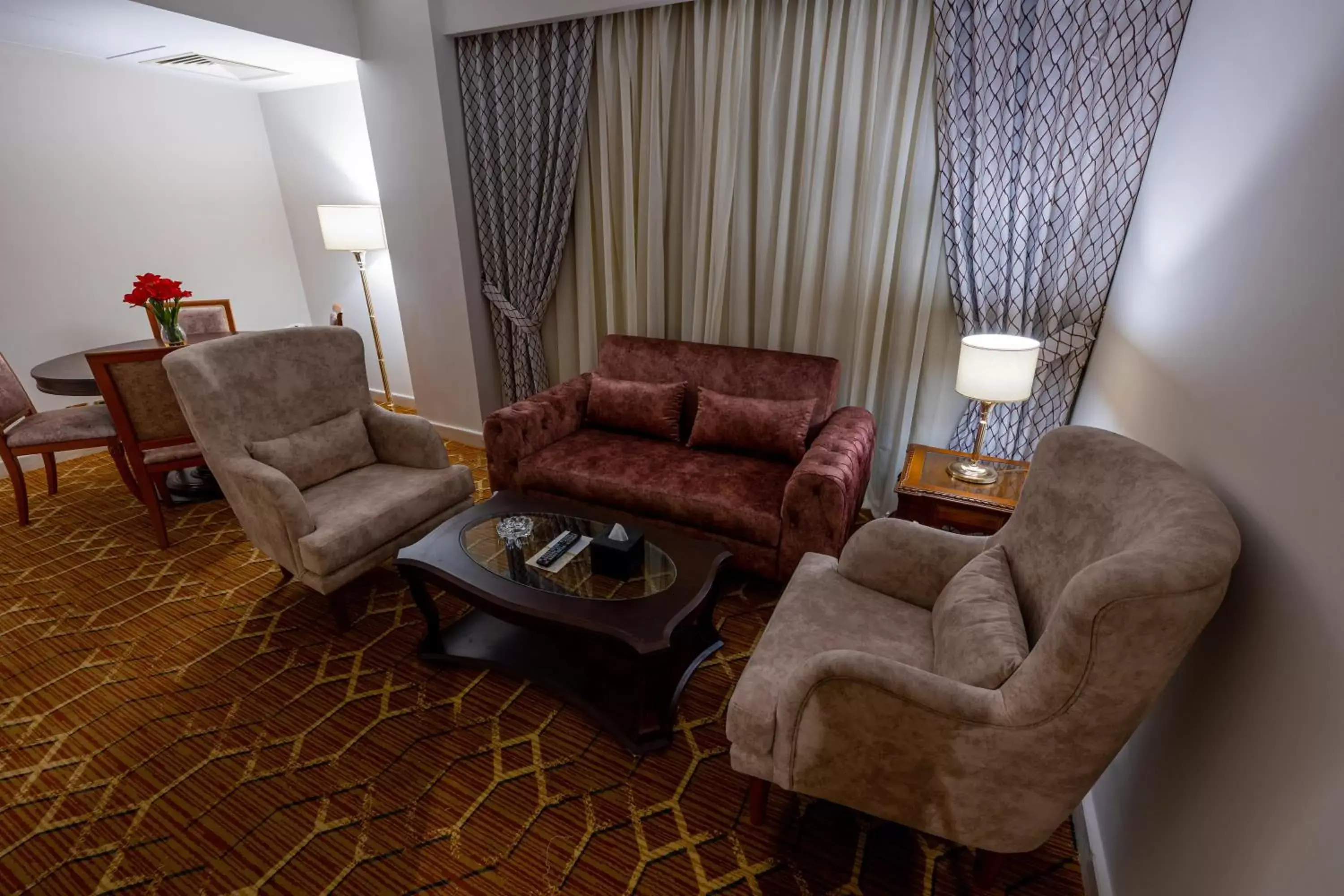 Photo of the whole room, Seating Area in Triumph Plaza Hotel