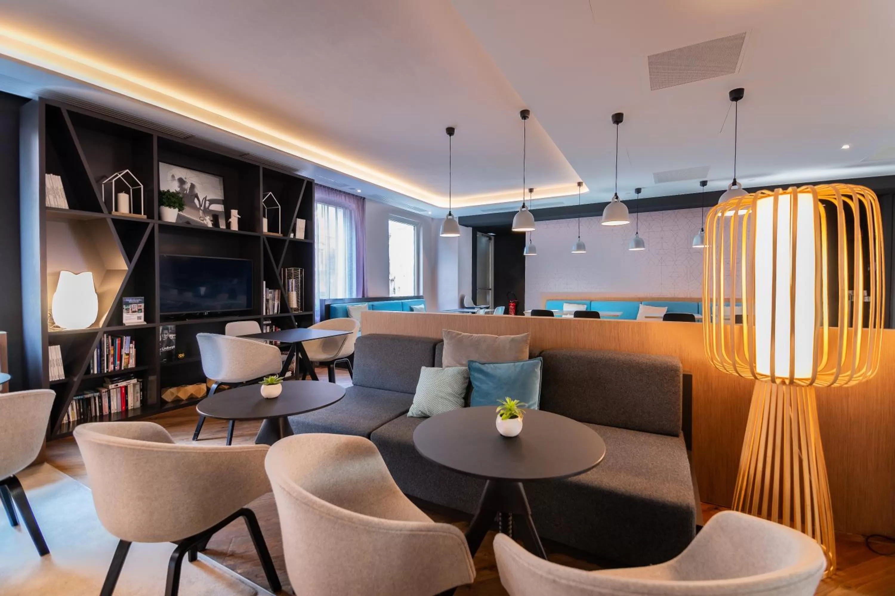 Communal lounge/ TV room in Novotel Suites Colmar Centre