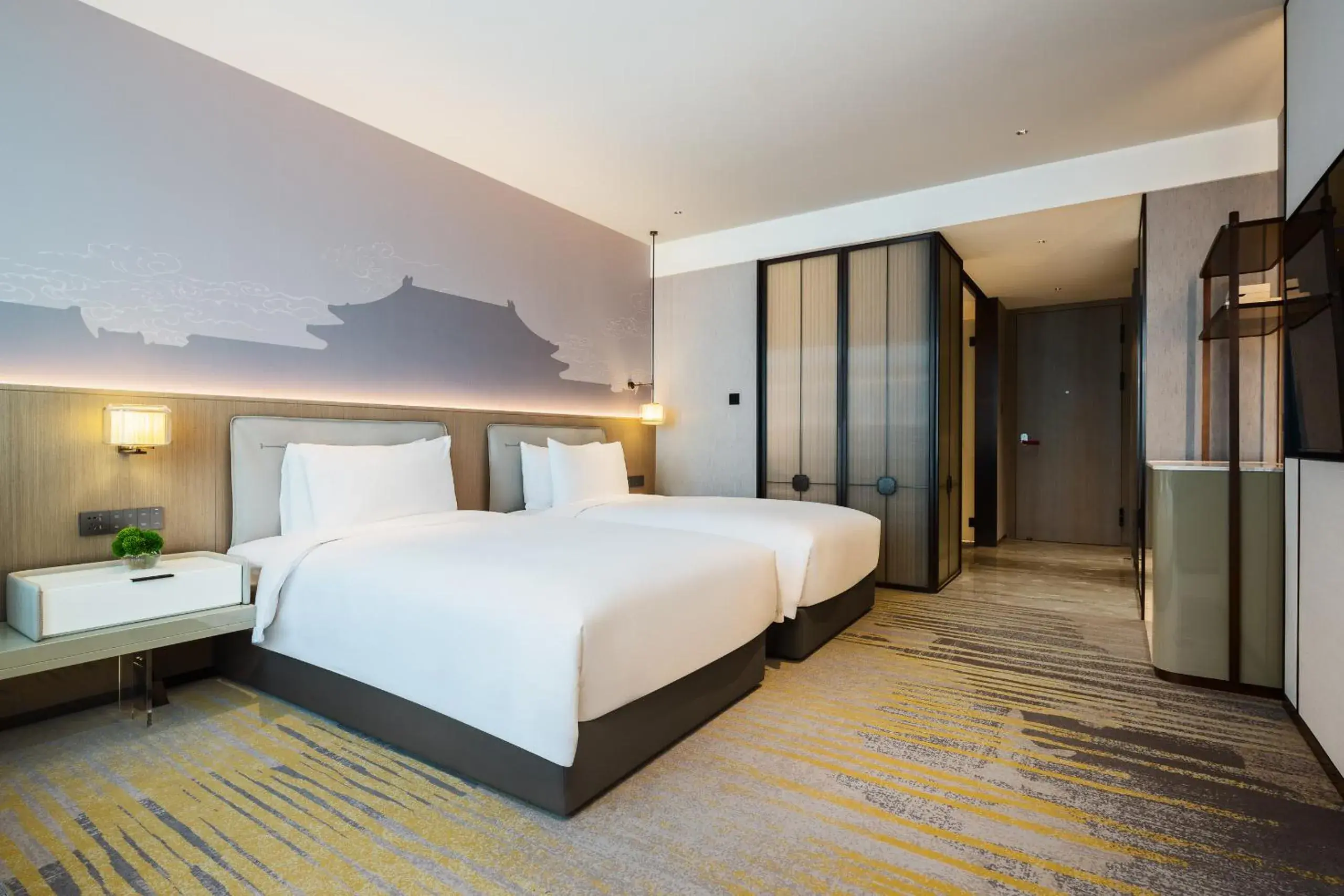 Bed in Grand Metropark Yuantong Hotel