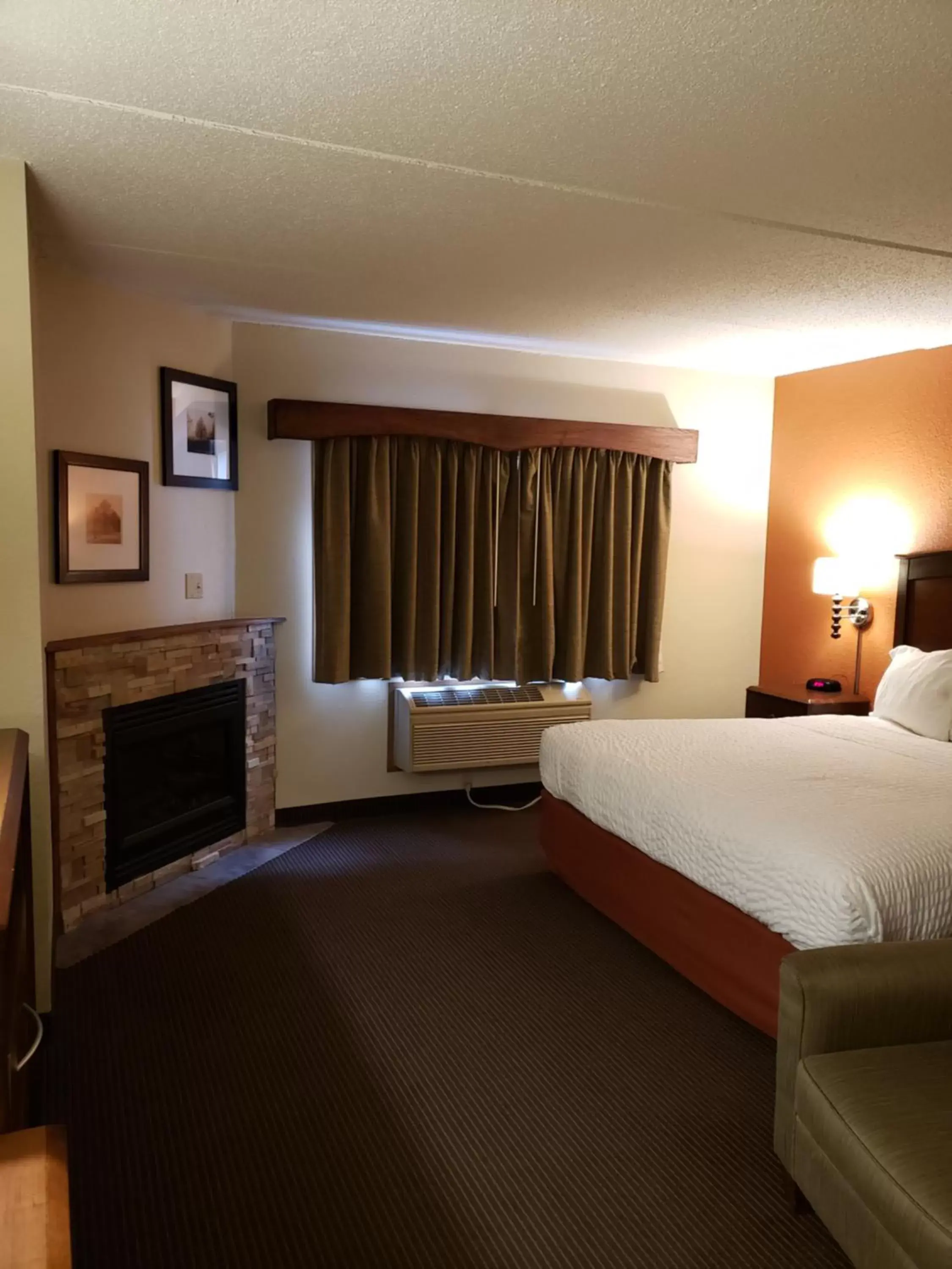 Bed in AmericInn by Wyndham Iron River