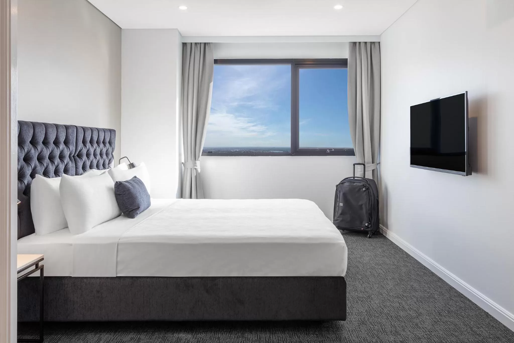 Bed in Meriton Suites Kent Street, Sydney