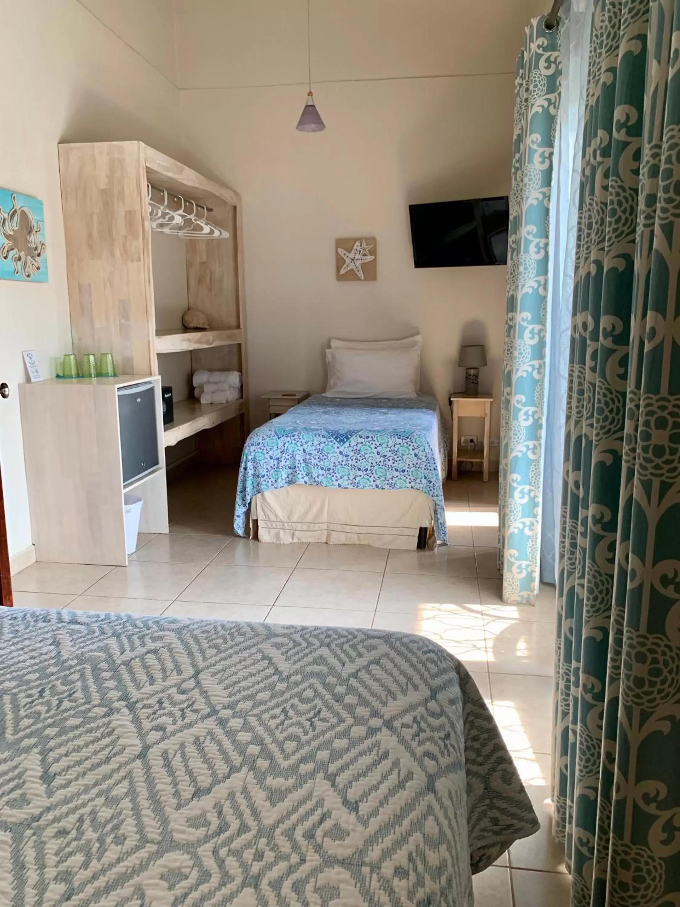 Photo of the whole room, Bed in Ten North Tamarindo Beach Hotel