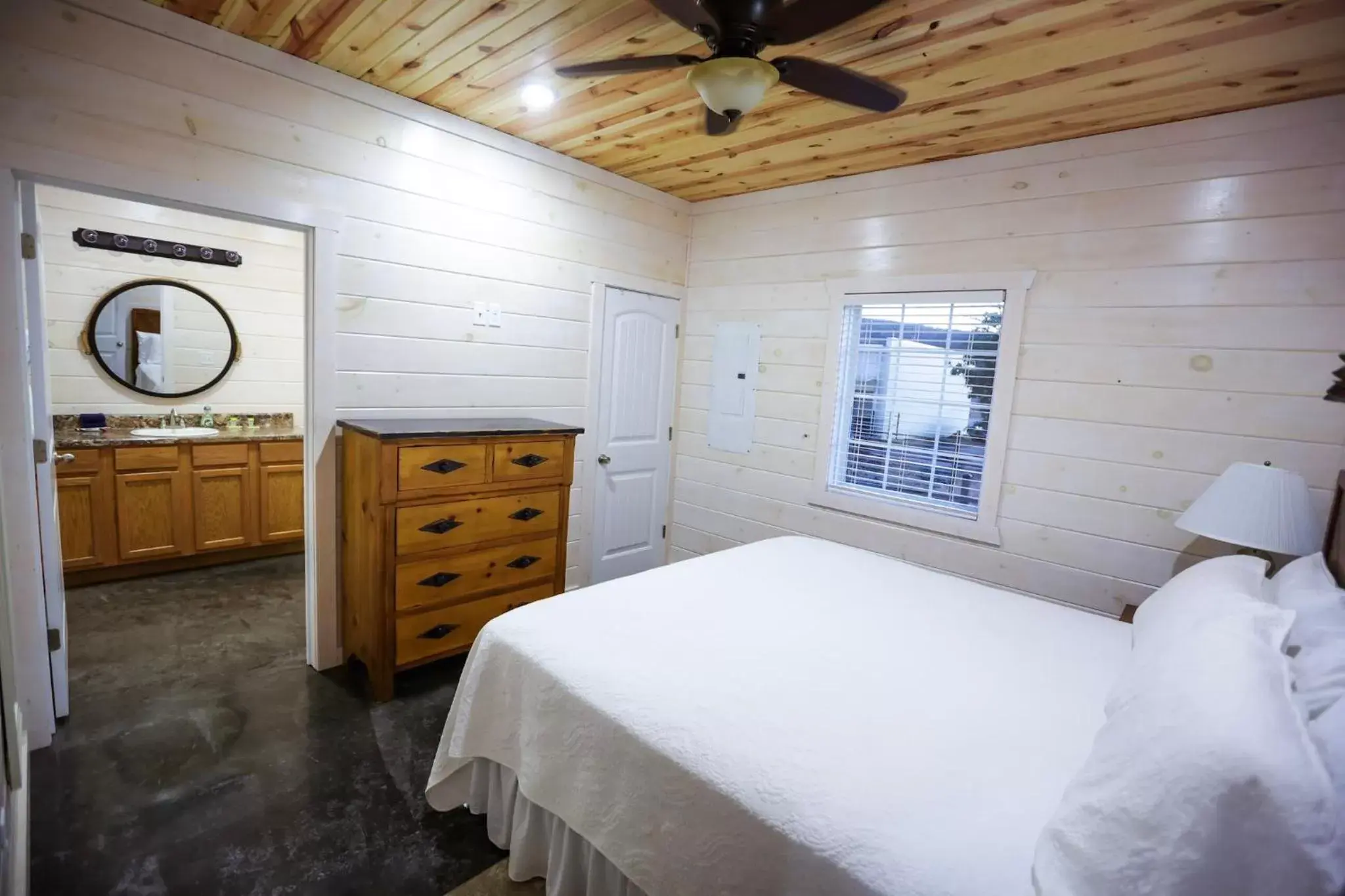 Bedroom, Bed in Knotty Squirrel Cabins