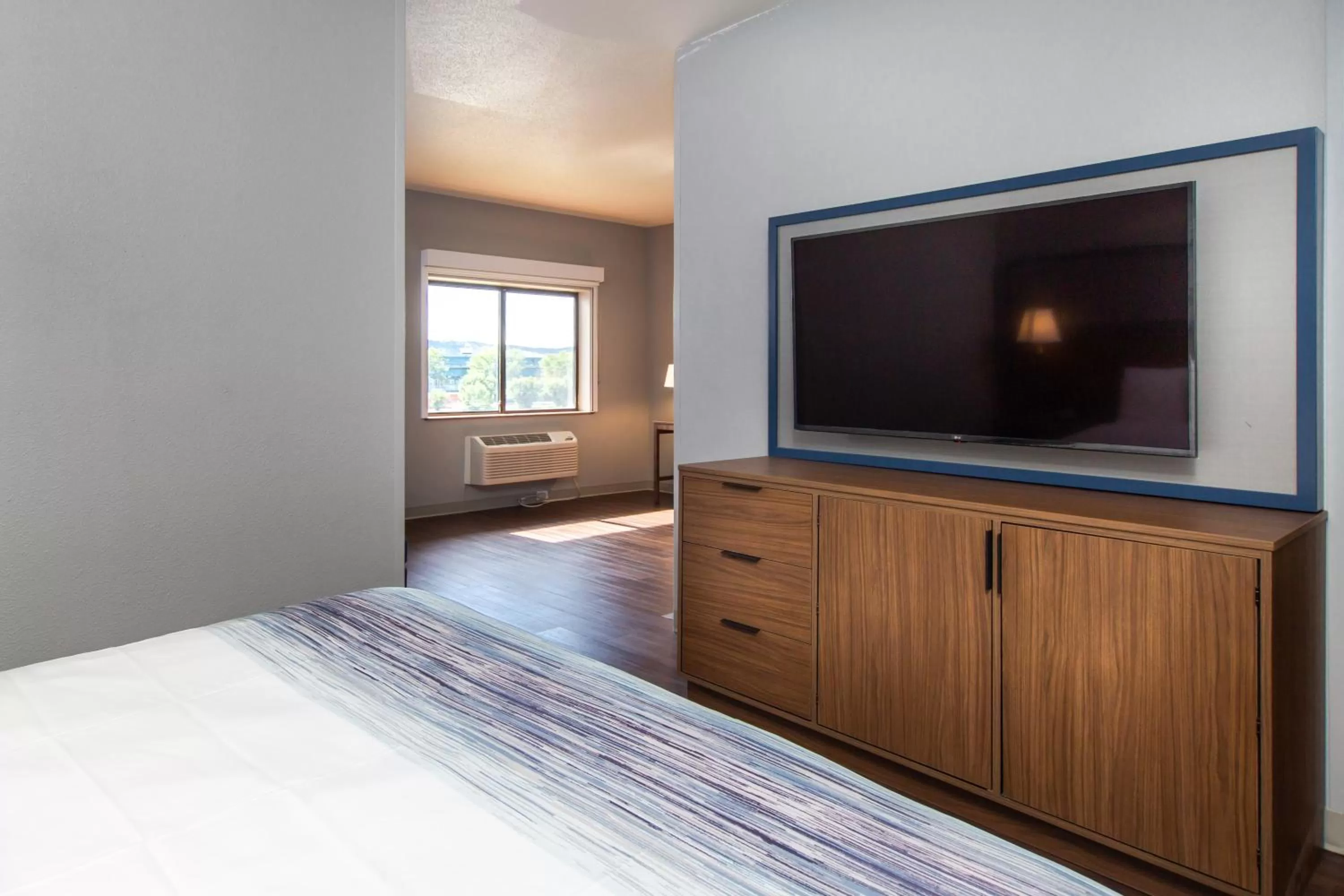 TV and multimedia, Bed in AmericInn by Wyndham Rapid City