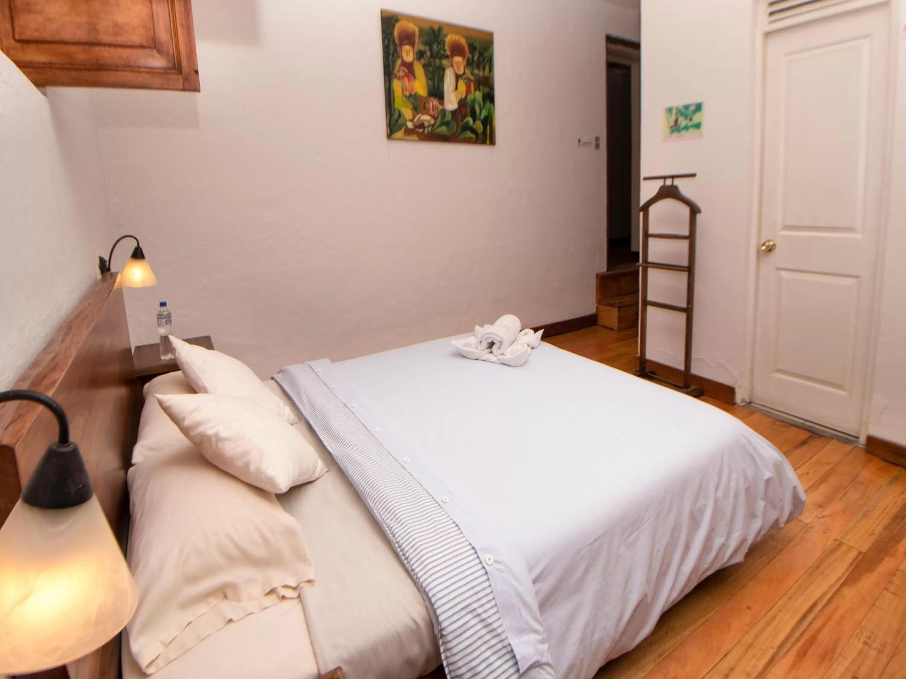 Bed in Hosteria Papagayo Cotopaxi