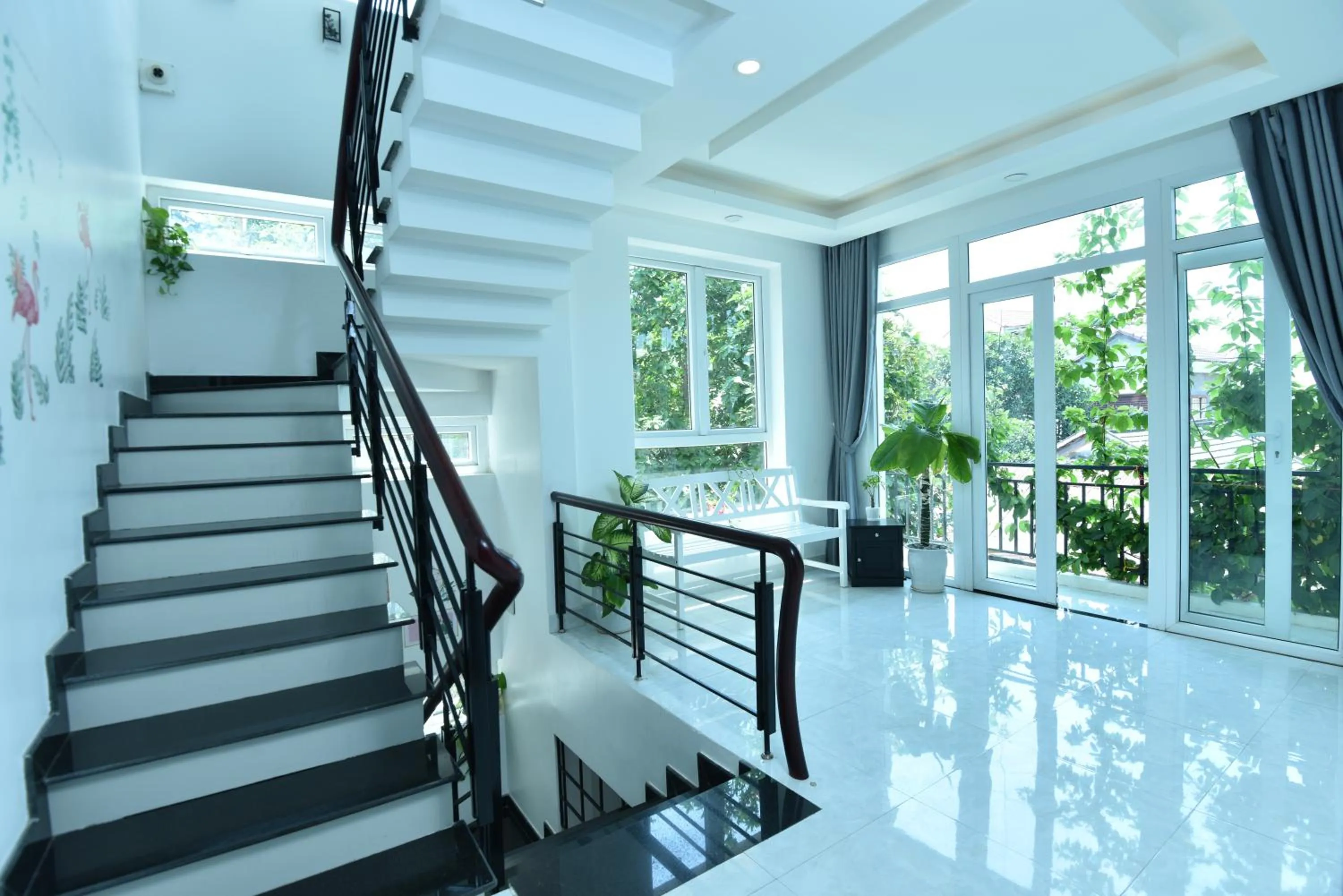Seating area in Flamingo Villa Homestay - Big Rooms with Balcony - Close to Hoi An Old Town 200m & Temple Bridge - Large Outside Pool for Sun Bathing