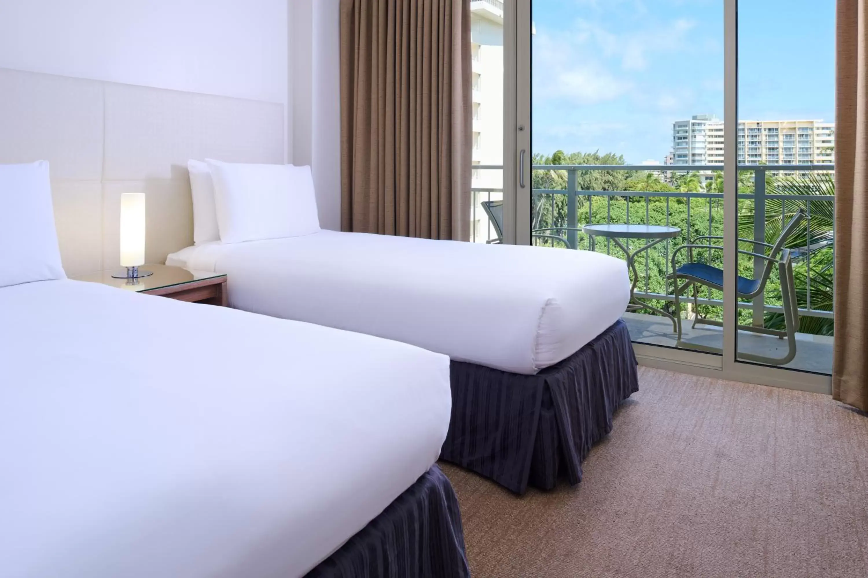 Bed in Kaimana Beach Hotel