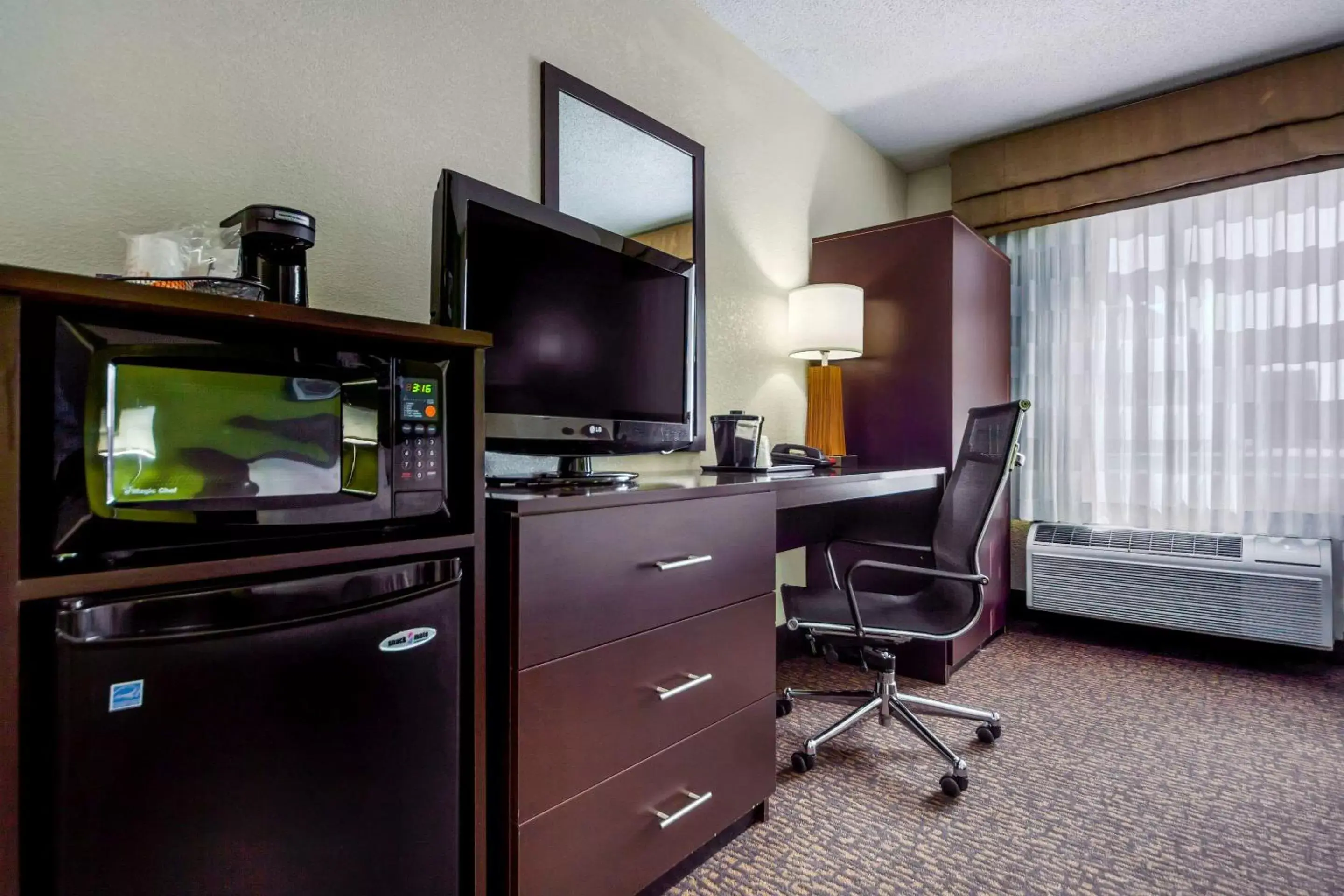 Photo of the whole room, TV/Entertainment Center in Sleep Inn By Choice Hotels