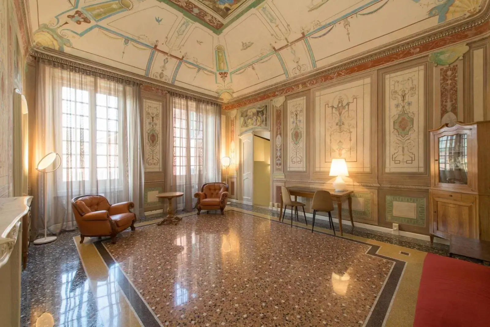 Communal lounge/ TV room in Palazzo Sertorio Suites