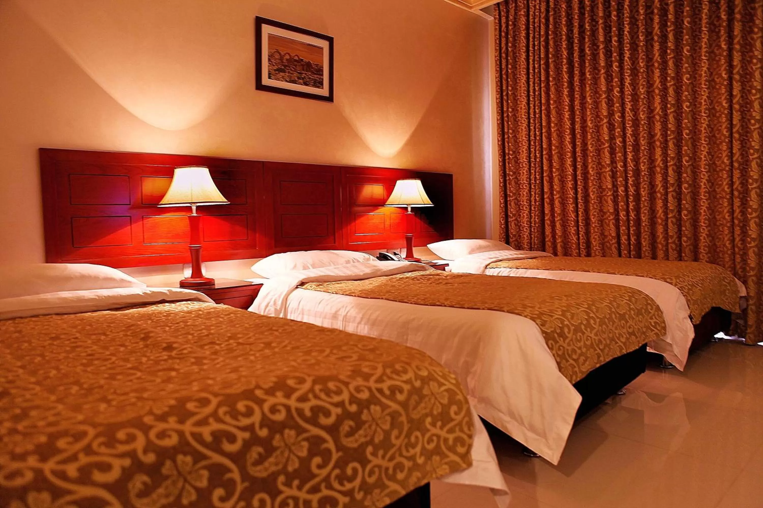 Bed in Mosaic City Hotel