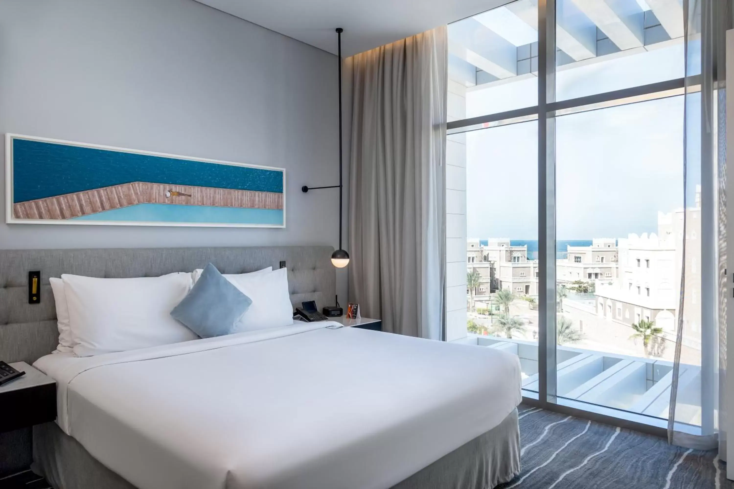 Bed in Th8 Palm Dubai Beach Resort Vignette Collection, an IHG hotel