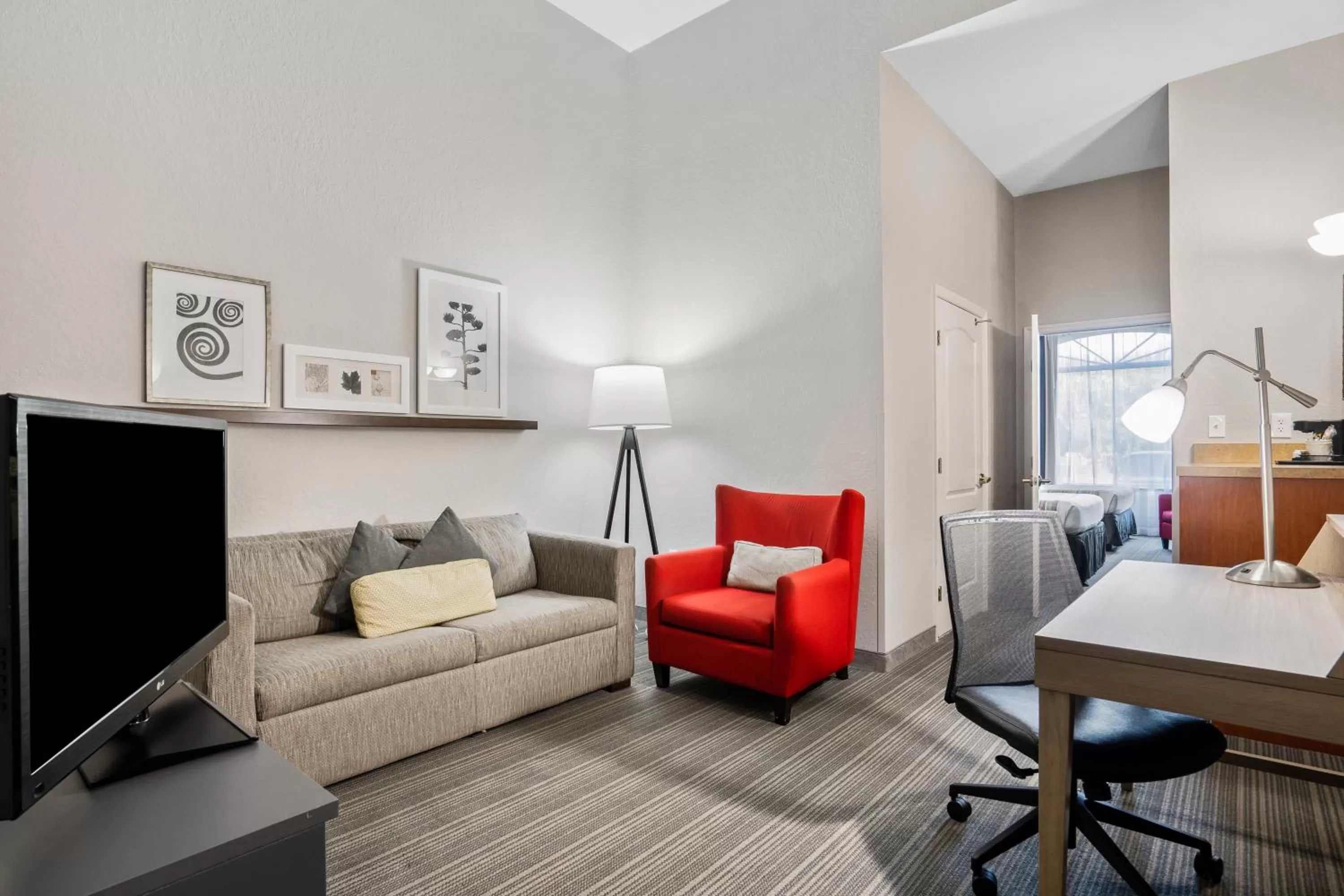 Seating area in Country Inn & Suites by Radisson, Port Canaveral, FL