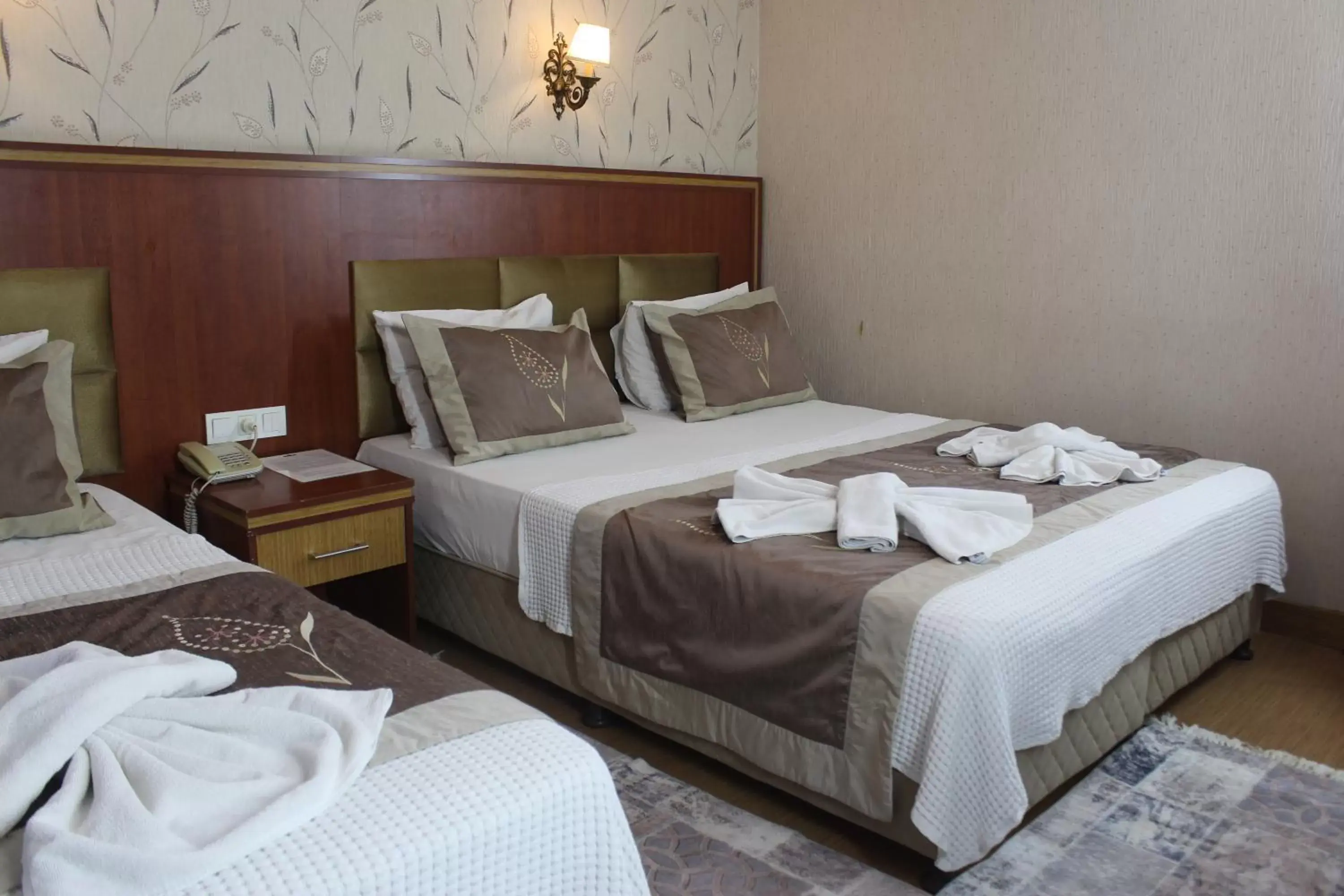 Bed in Hermanos Hotel