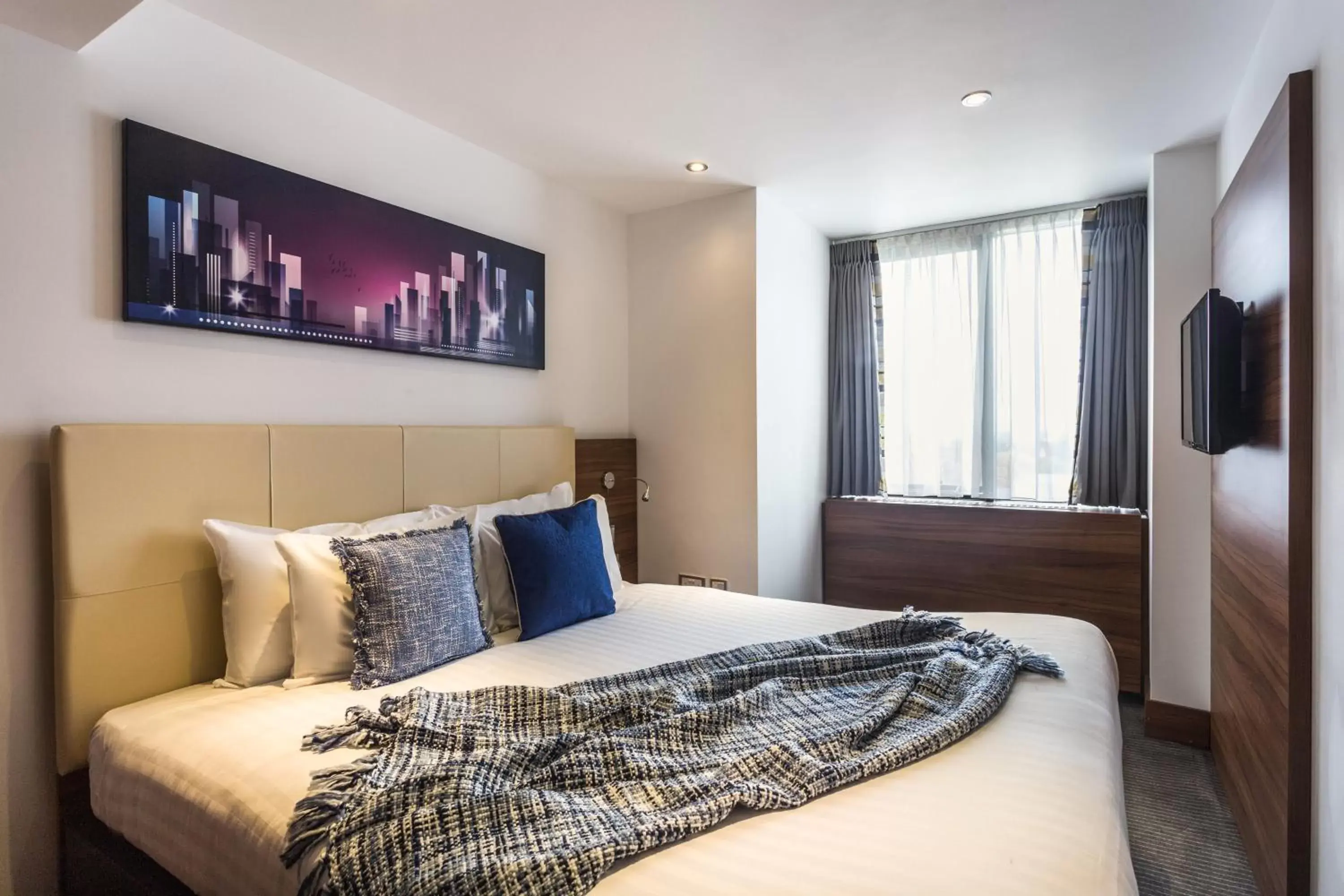 Bed in Livin' Serviced Apartments