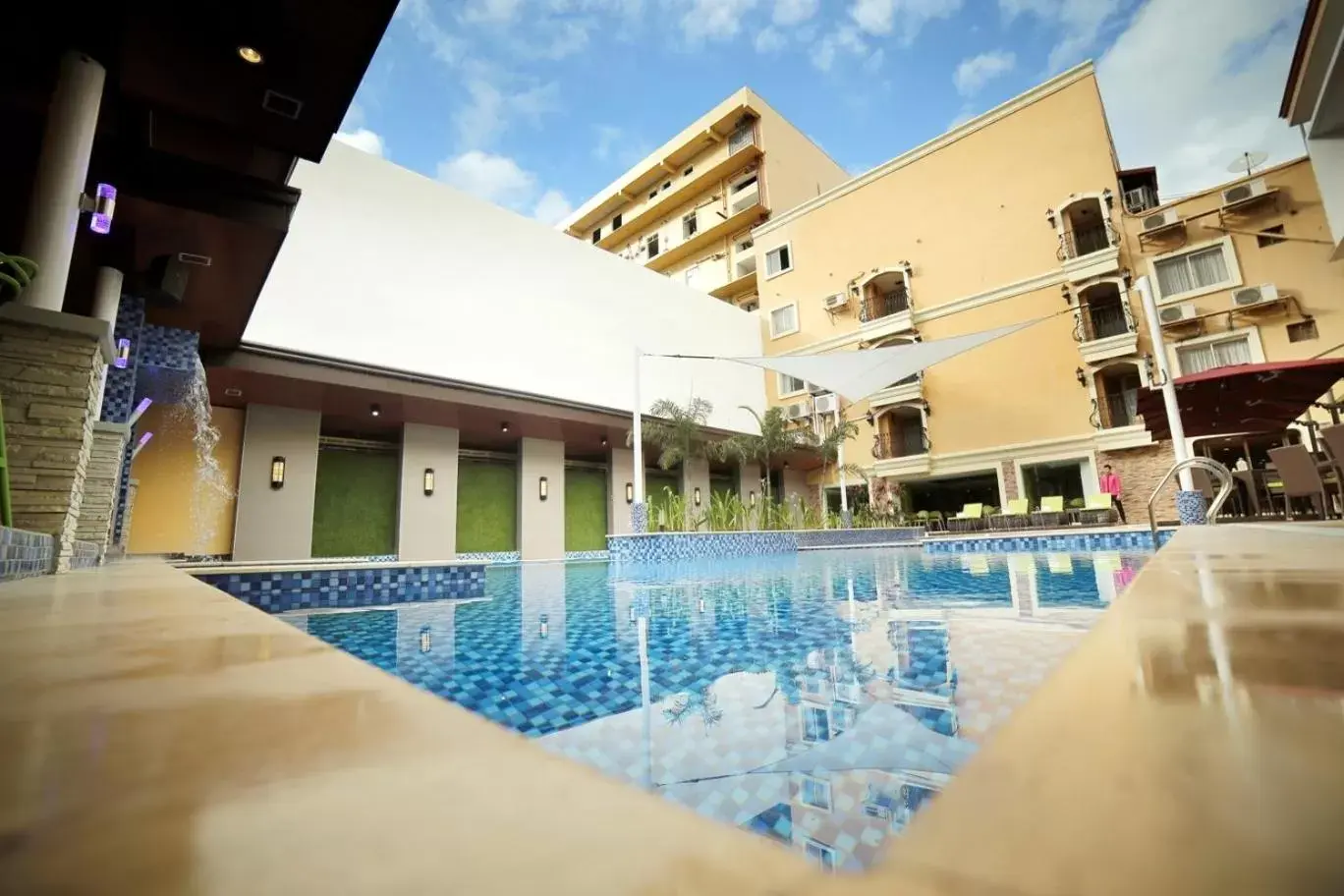 Swimming pool, Property Building in Villa Caceres Hotel