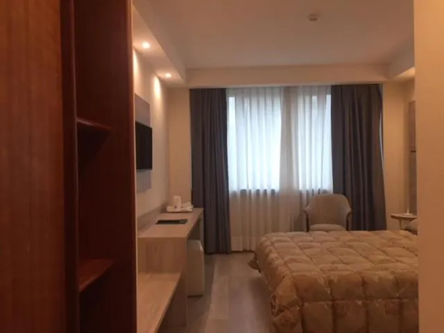 Bed in Hostellerie Du Cheval Blanc