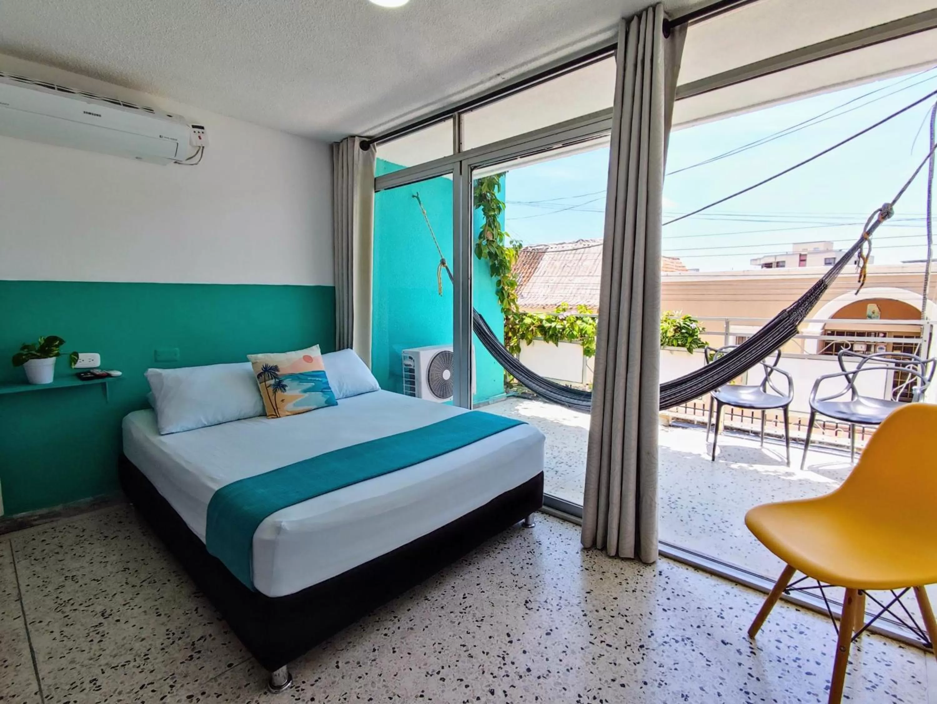 Bed in Bona Vida Hotel