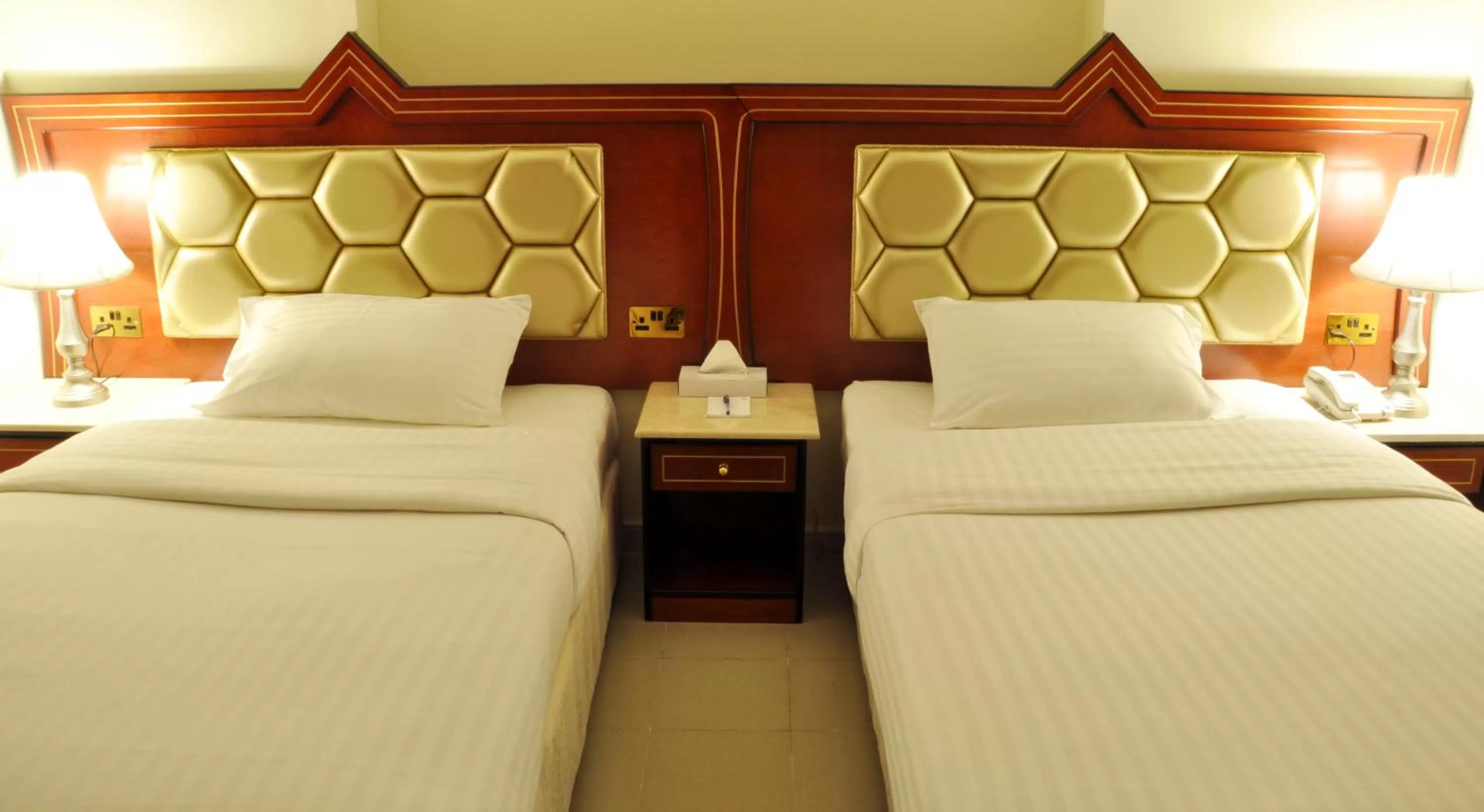 Bed in Saffron Hotel
