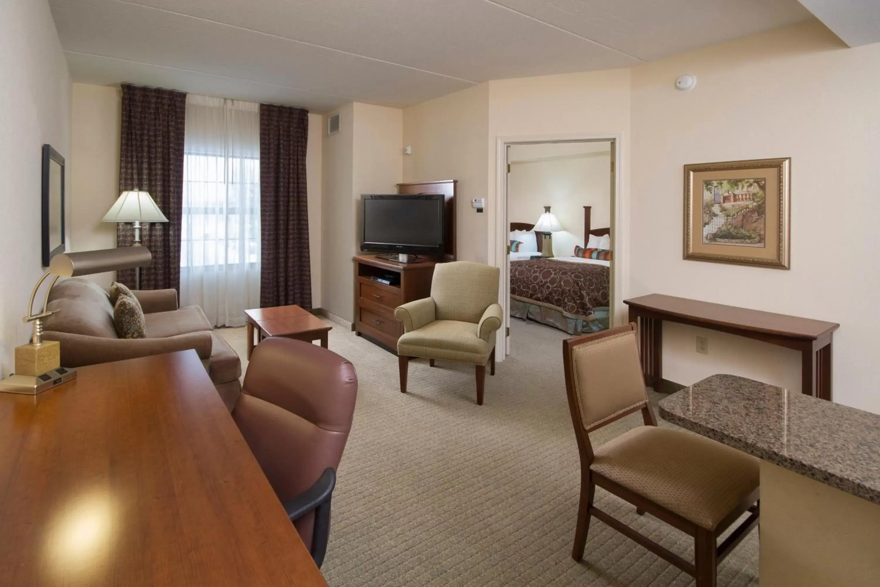 Photo of the whole room, Seating Area in Staybridge Suites Buffalo, an IHG Hotel