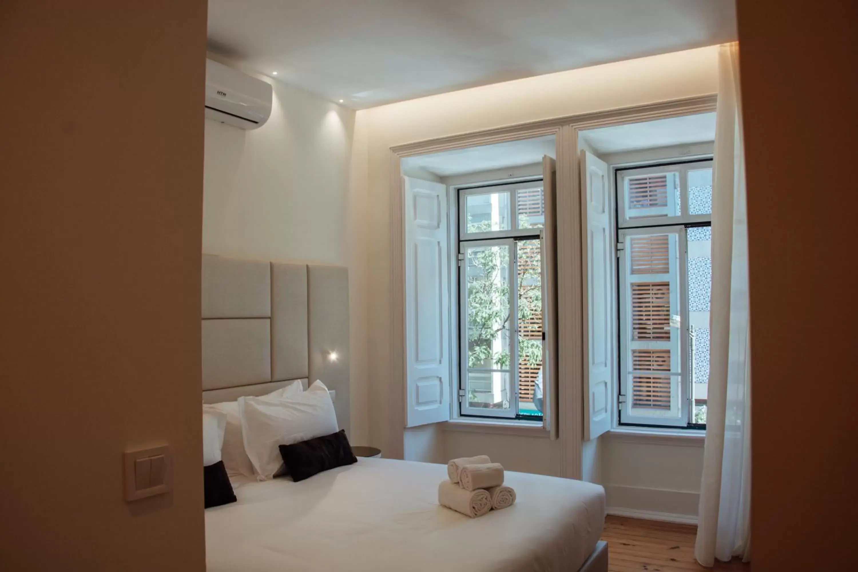 Bed in Le Premier Lisbon Suites