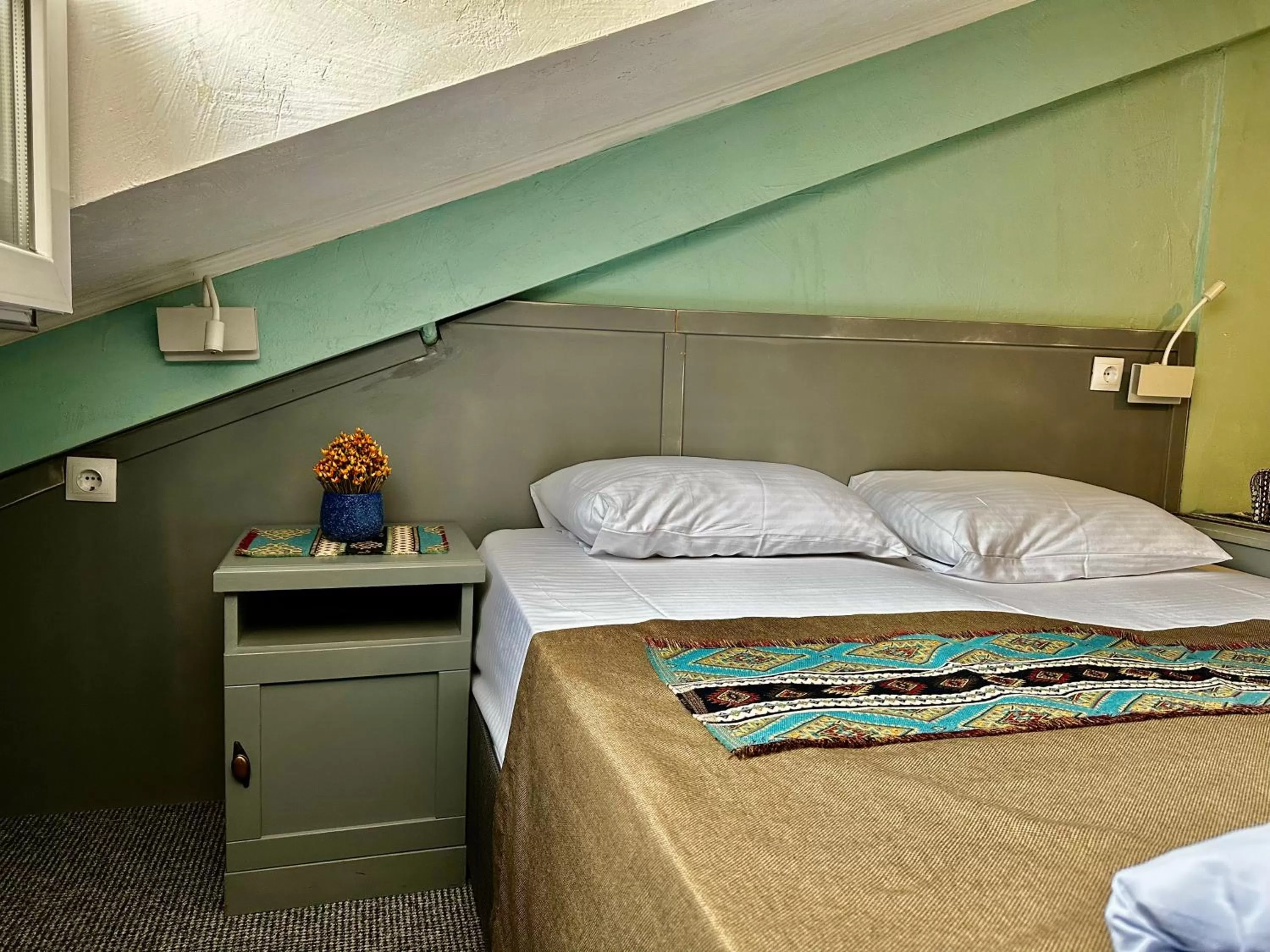 Bed in Kindli Boutique Hotel