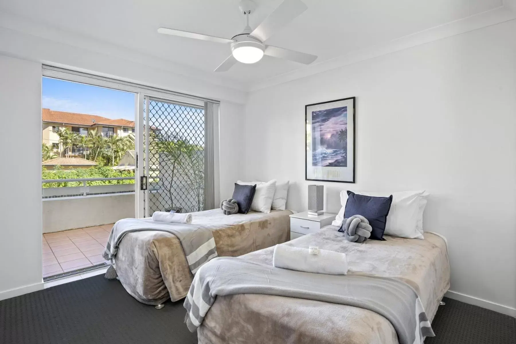 Bed in Kirra Palms Holiday Apartments