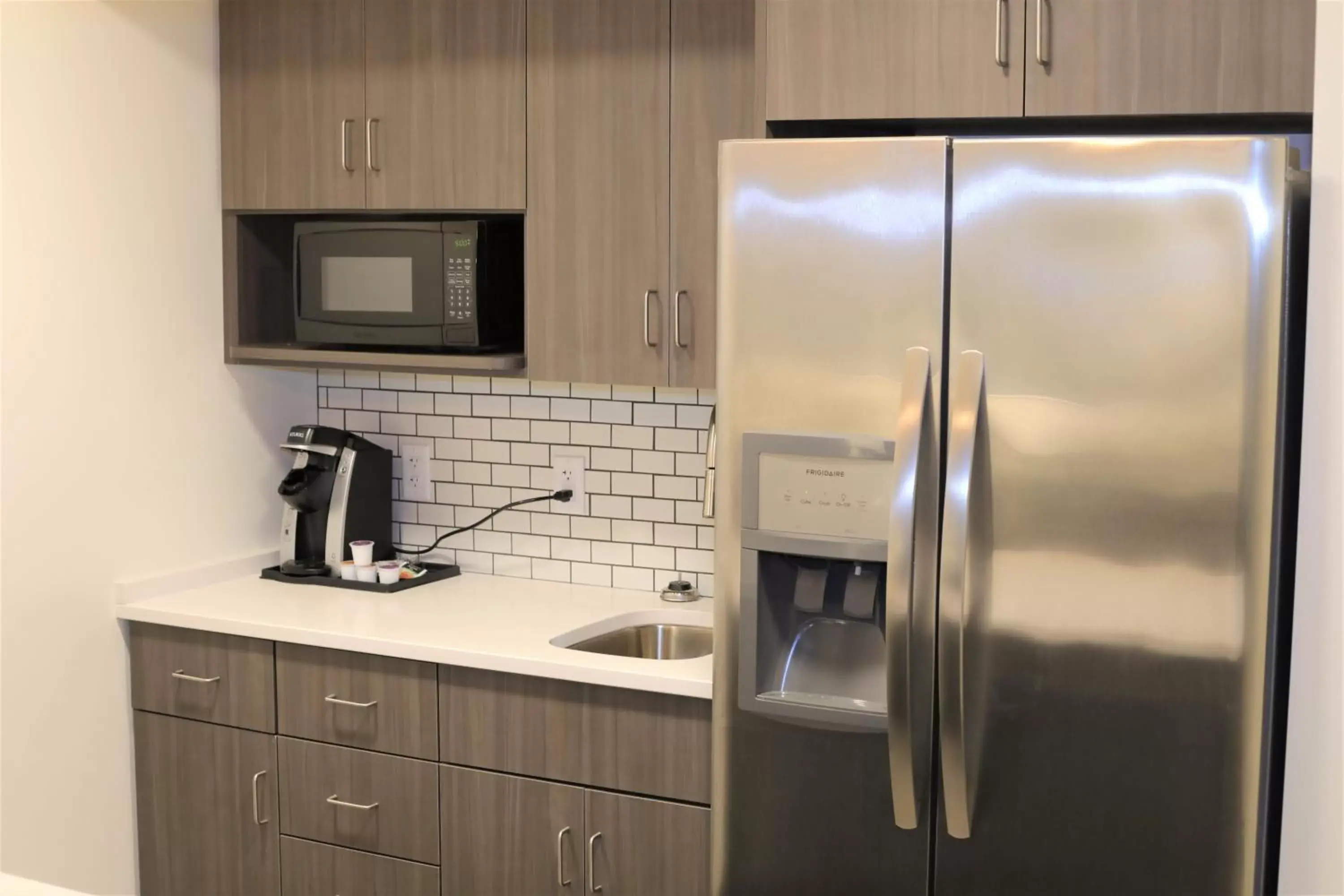 Photo of the whole room, Kitchen/Kitchenette in Holiday Inn & Suites St. Cloud, an IHG Hotel