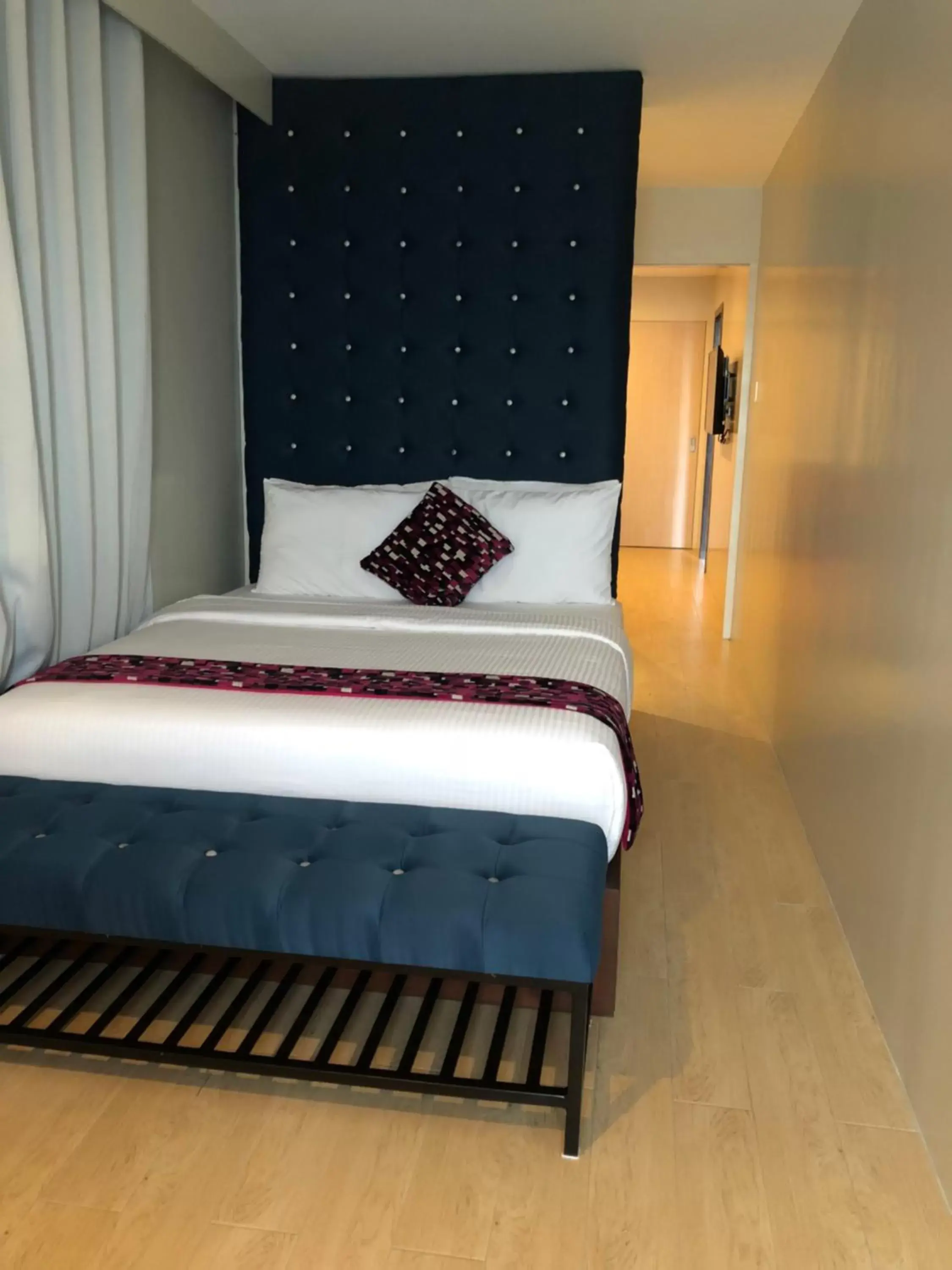 Bed in The Madeline Boutique Hotel & Suites