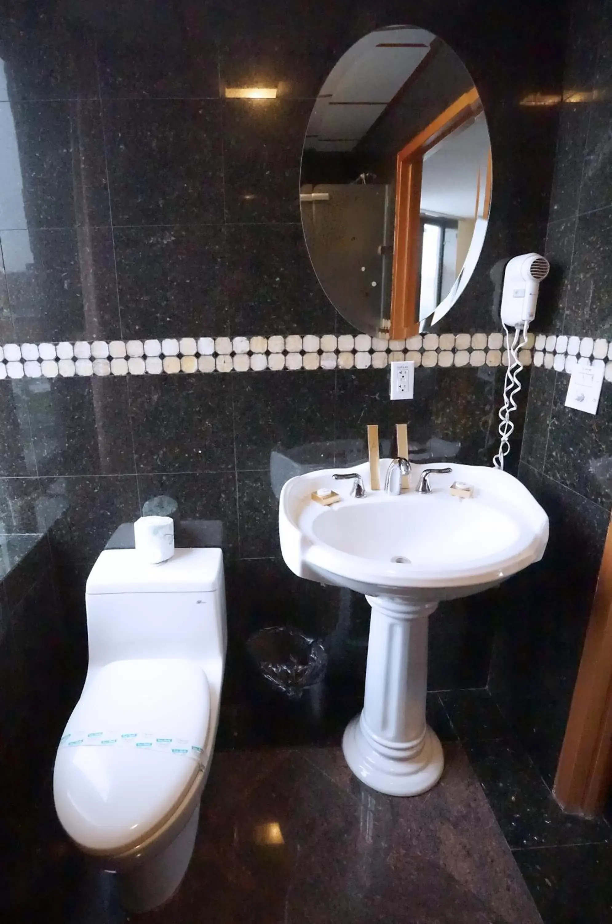 Bathroom in Paris Suites Hotel