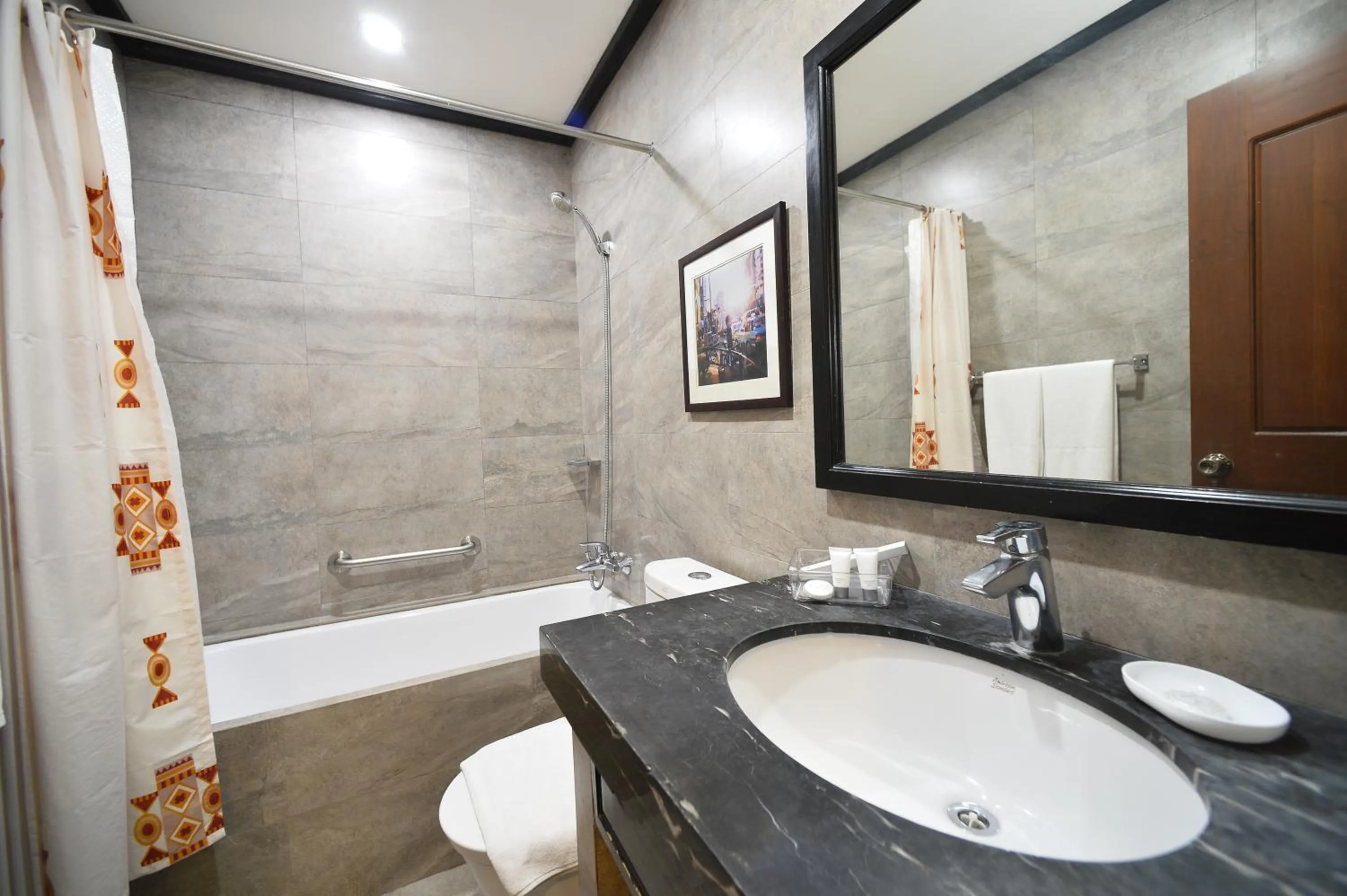 Bathroom in Paragon Hotel and Suites