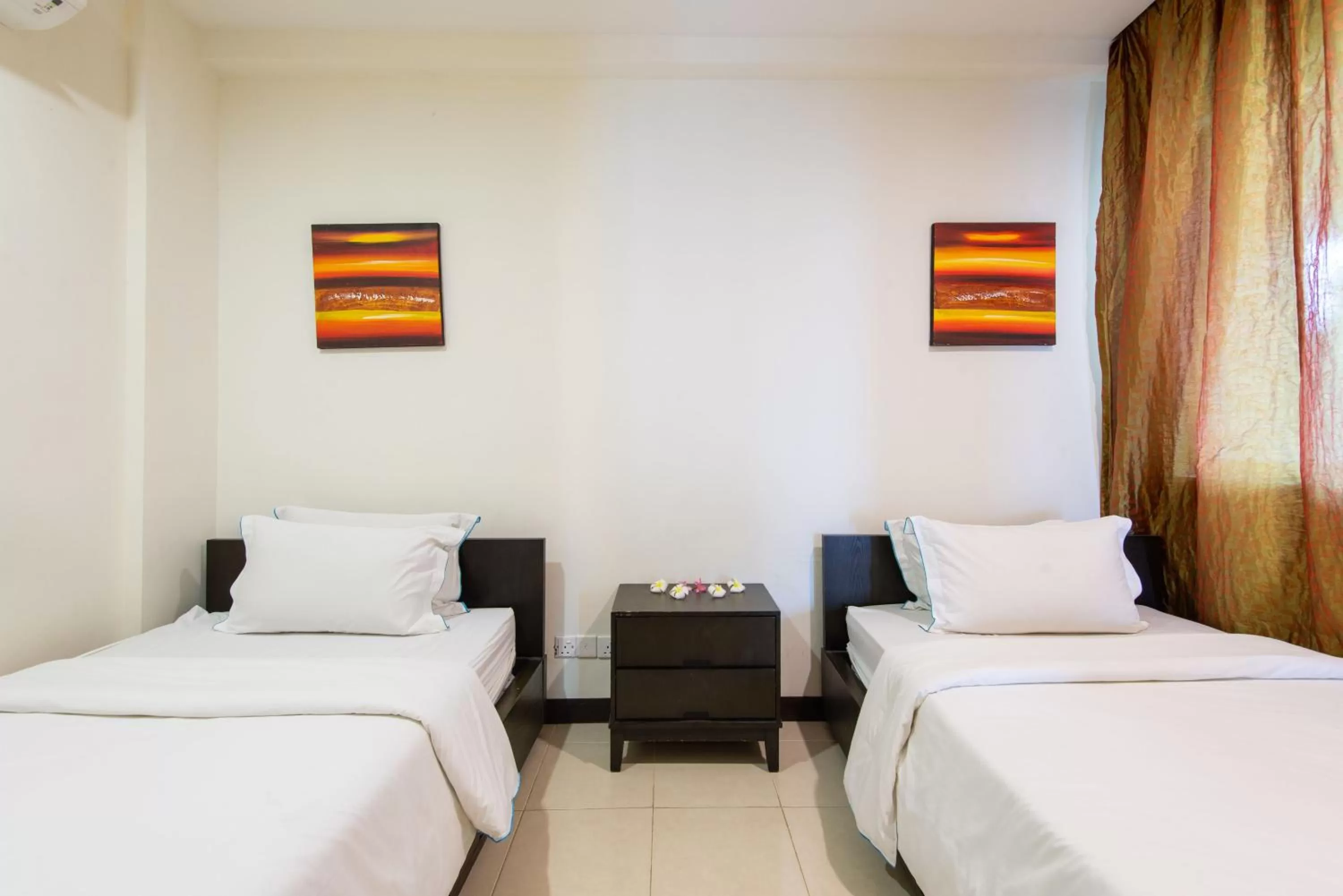 Bed in Sabah Beach Villas & Suites