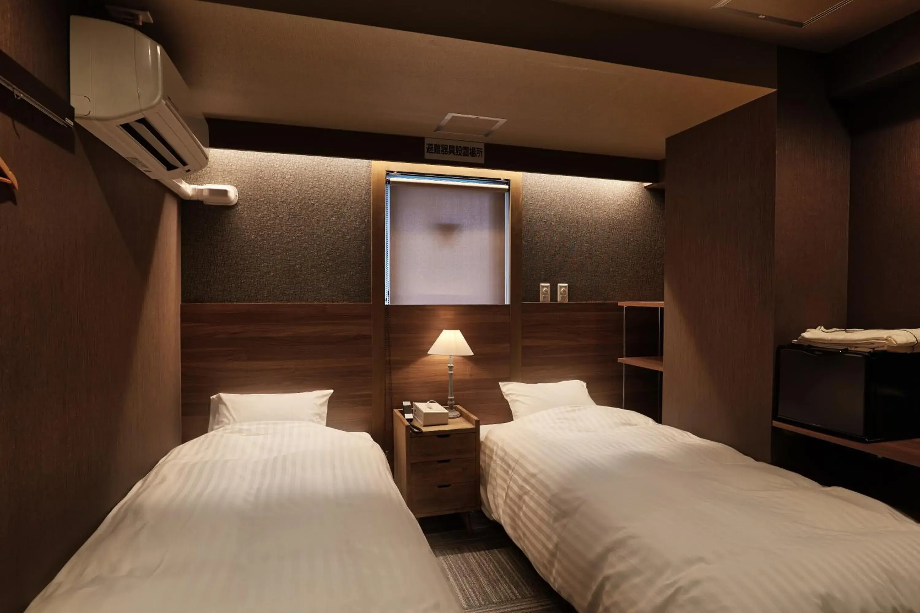 Bed in Ryuka Hotel Naha