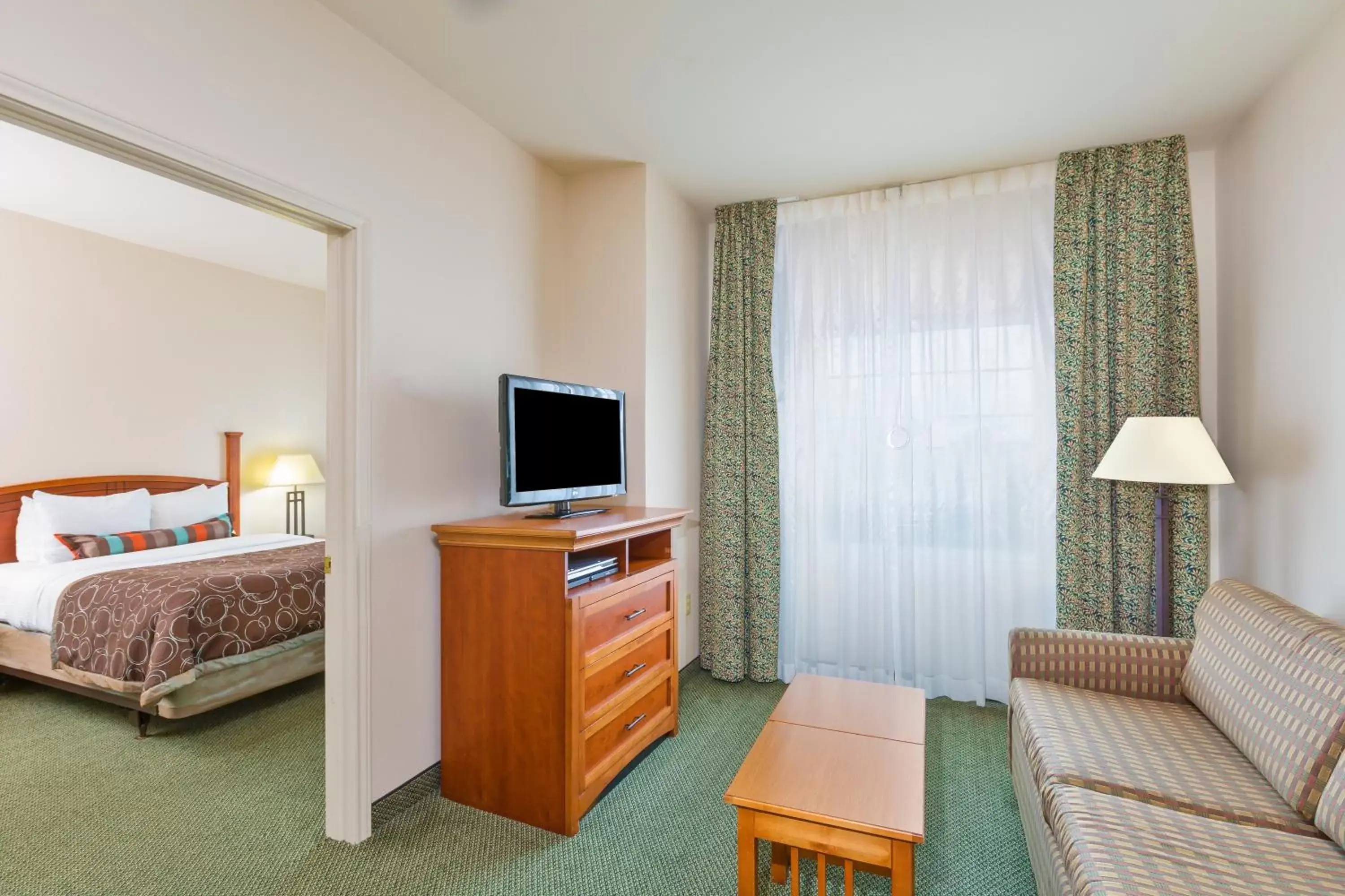 Bedroom, TV/Entertainment Center in Staybridge Suites - Brownsville, an IHG Hotel