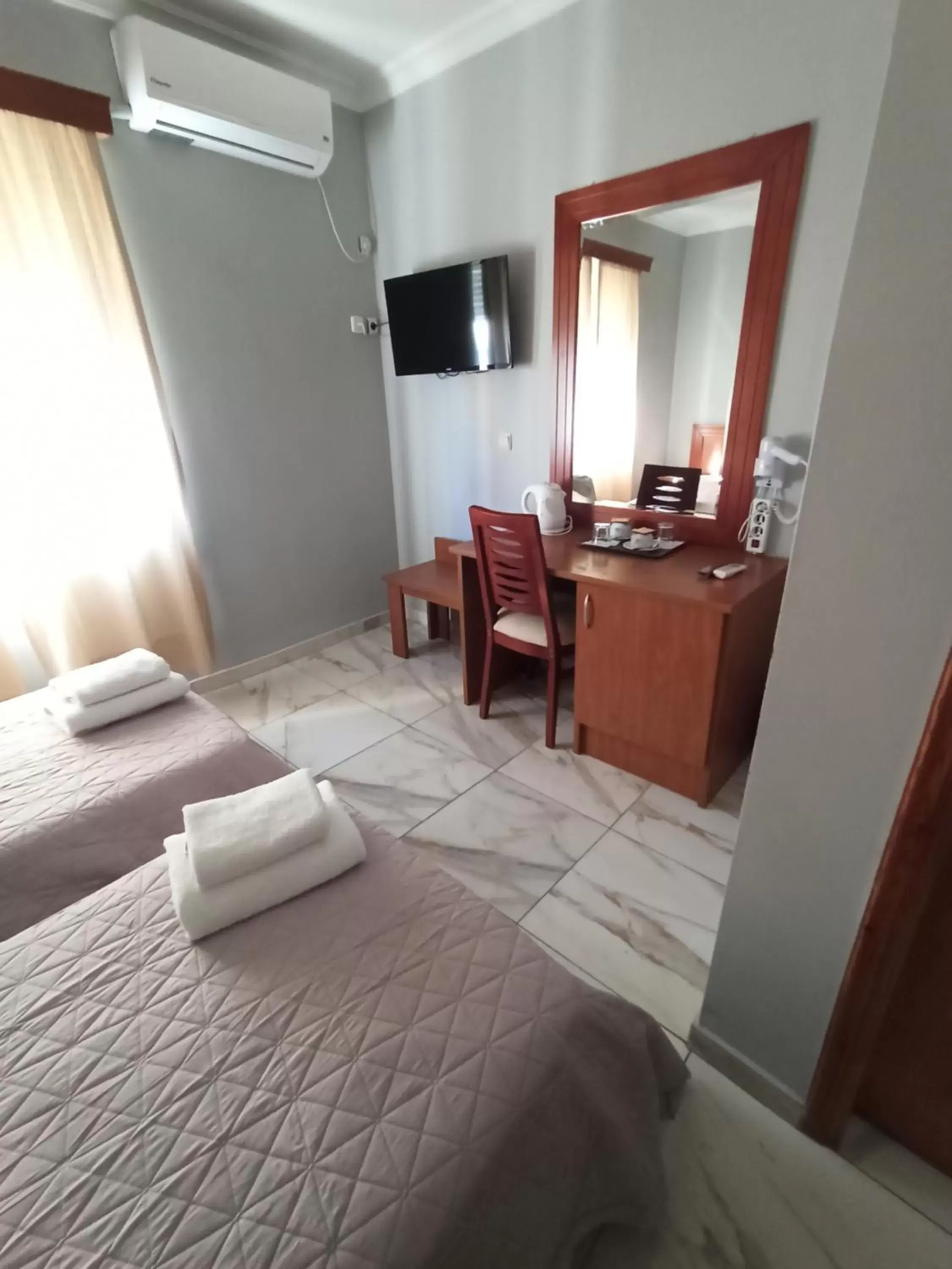 Bedroom, TV/Entertainment Center in Piraeus Acropole Hotel