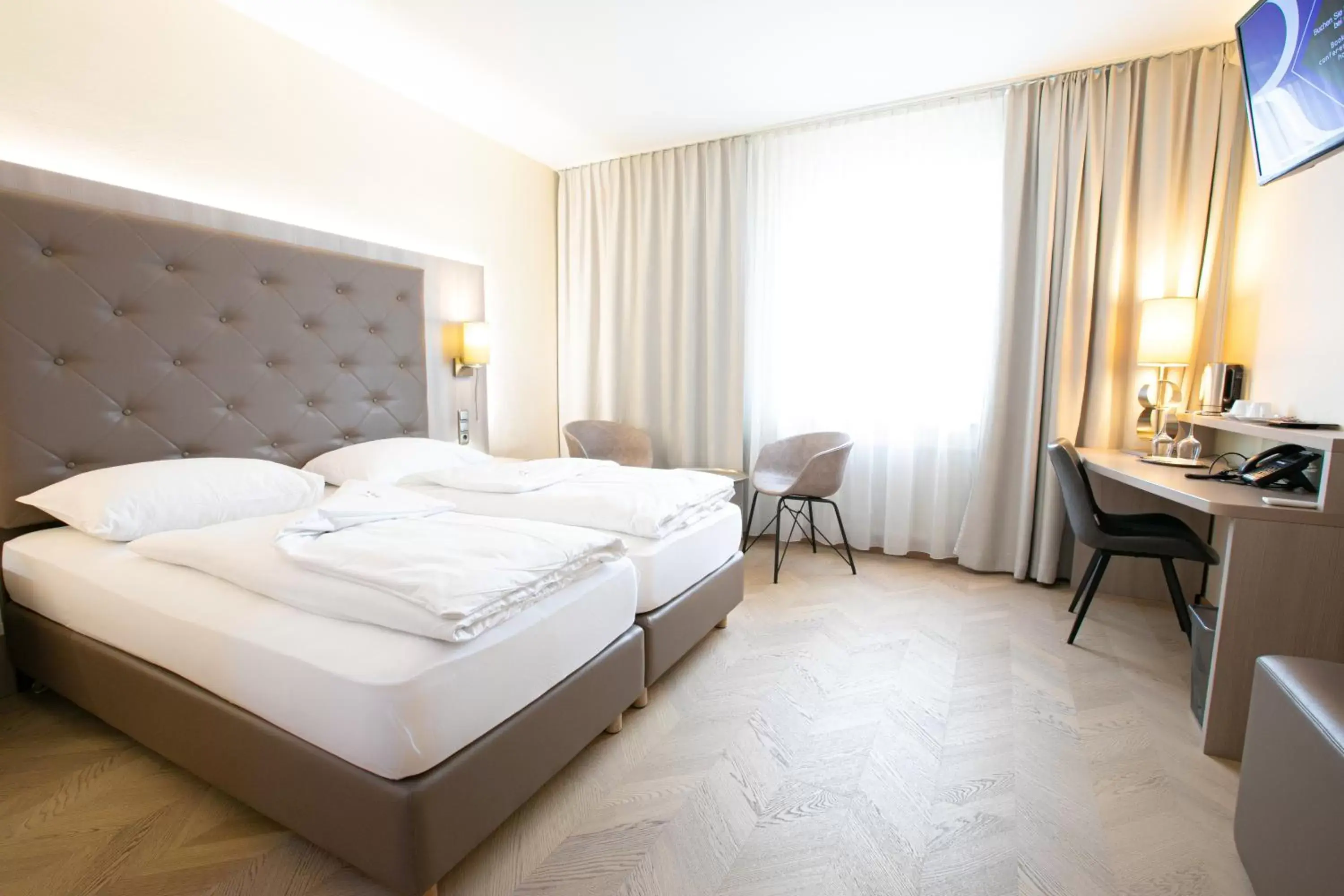 Photo of the whole room, Bed in Das Reinisch Airport Hotel & Restaurant