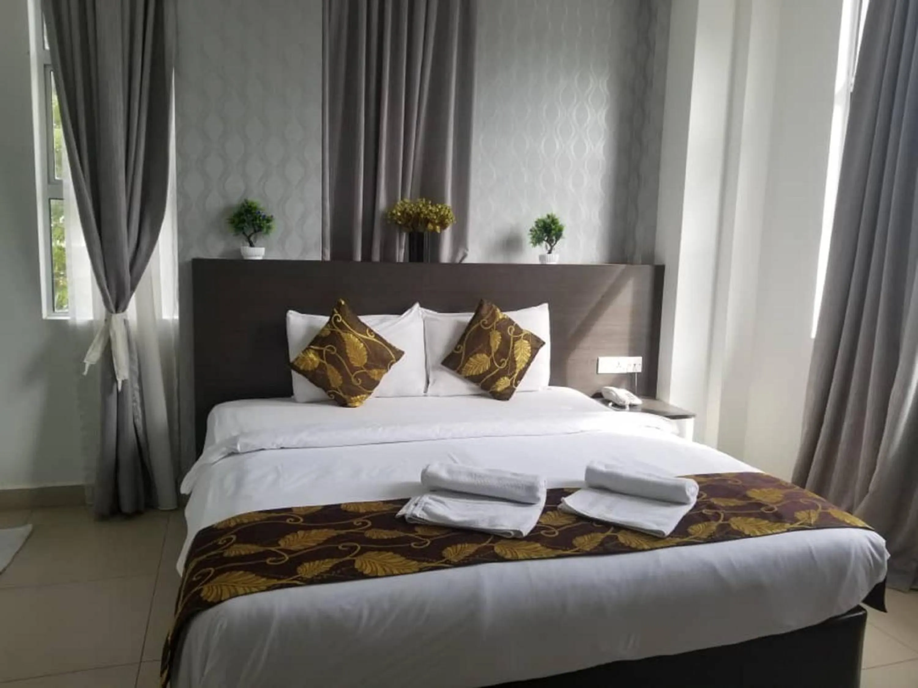 Photo of the whole room, Bed in D'Metro Hotel