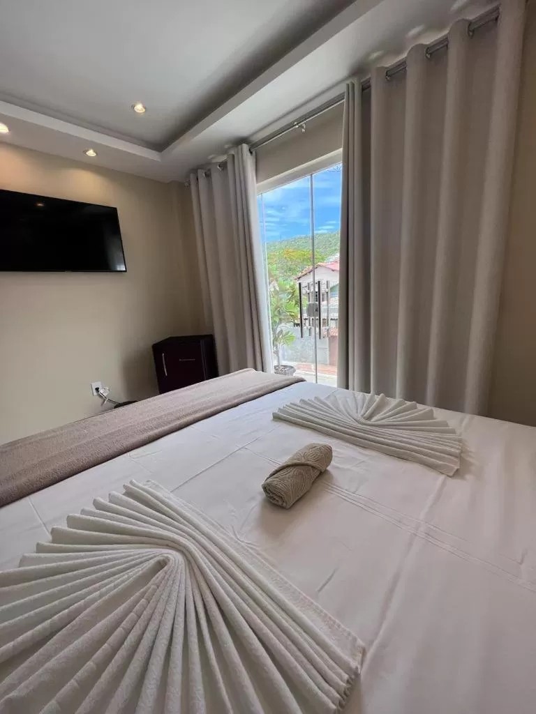 Bed in Pousada Arraial Tropical