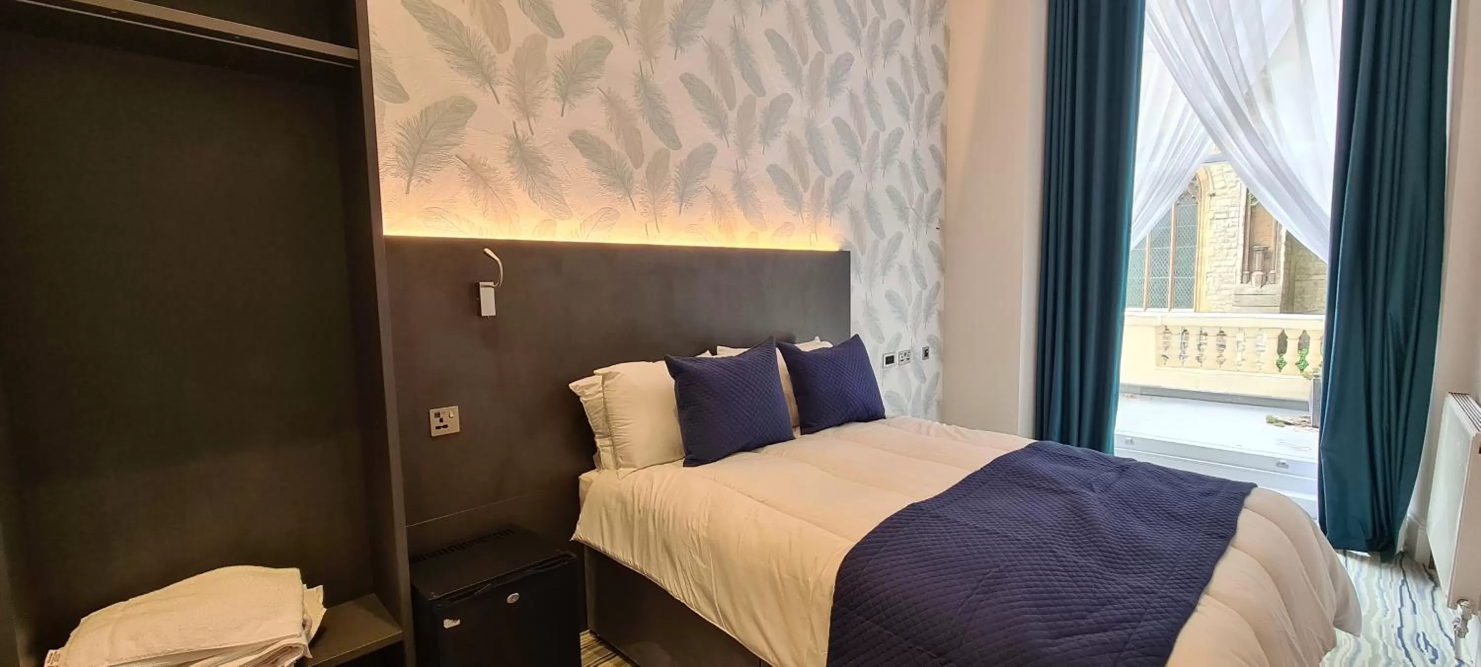 Bed in Commodore Hotel